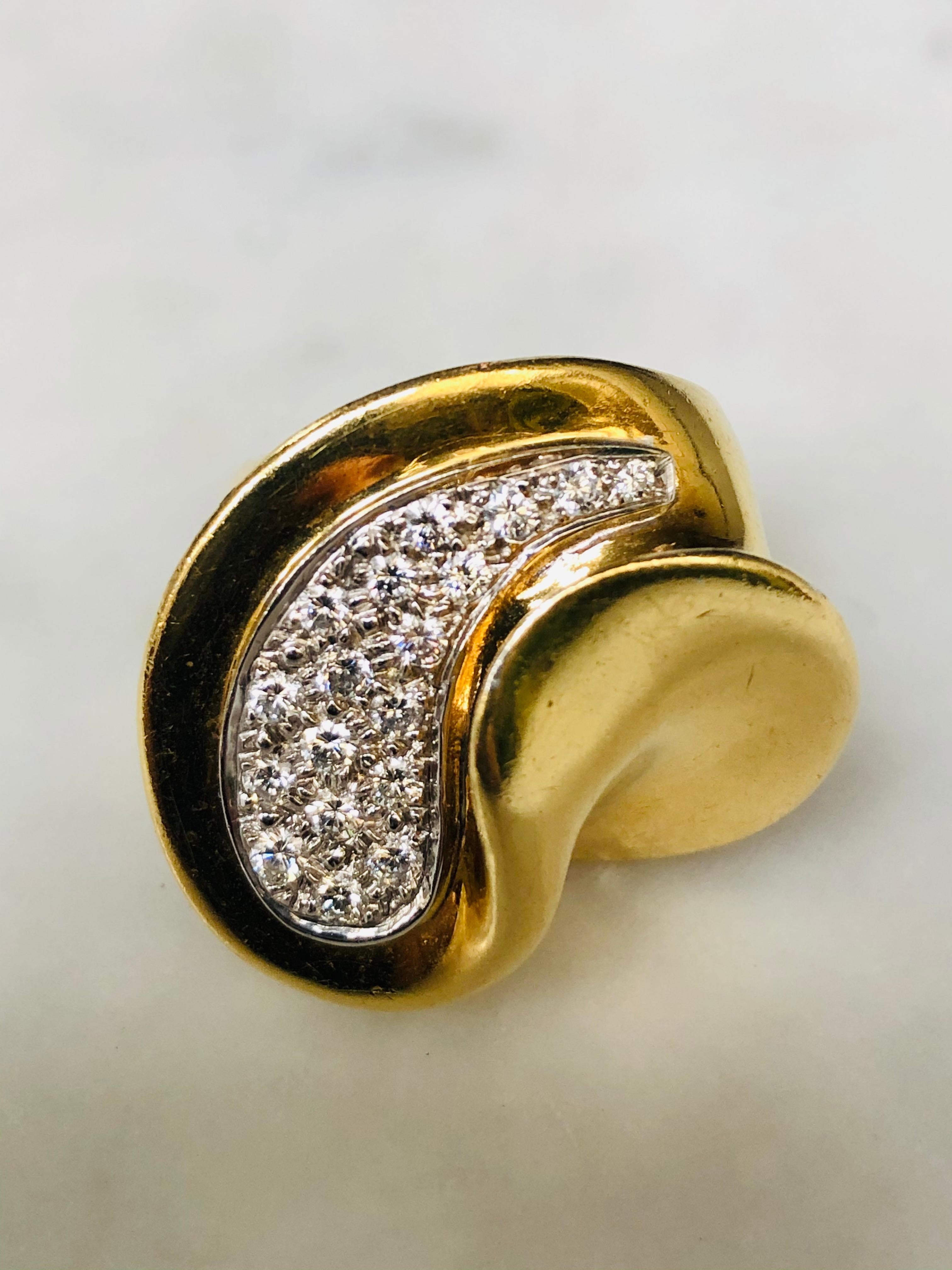 Large 18 carat Gold cocktail ring set with .80 carats of brilliant cut white diamonds. This sculptural ring has the credentials of an ‘Art Jewel’ with an Italian vibe. Italian diamond & yellow gold cuff bangle to complete the look available.

Weight