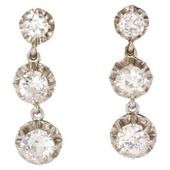 Gold and diamonds dangle earrings
