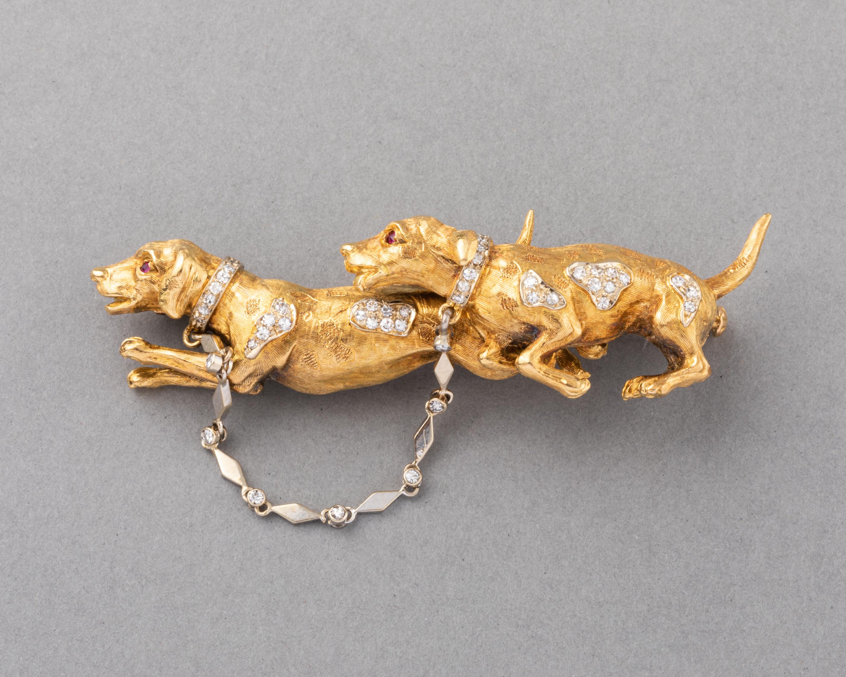 Very beautiful brooch, European made circa 1960.

Made in yellow gold 18k and set with diamonds.  There are hallmarks for gold, signature (unknown). 

The two dogs are very cute. The design and workmanship is quality.

Dimensions: 6.3 cm length and