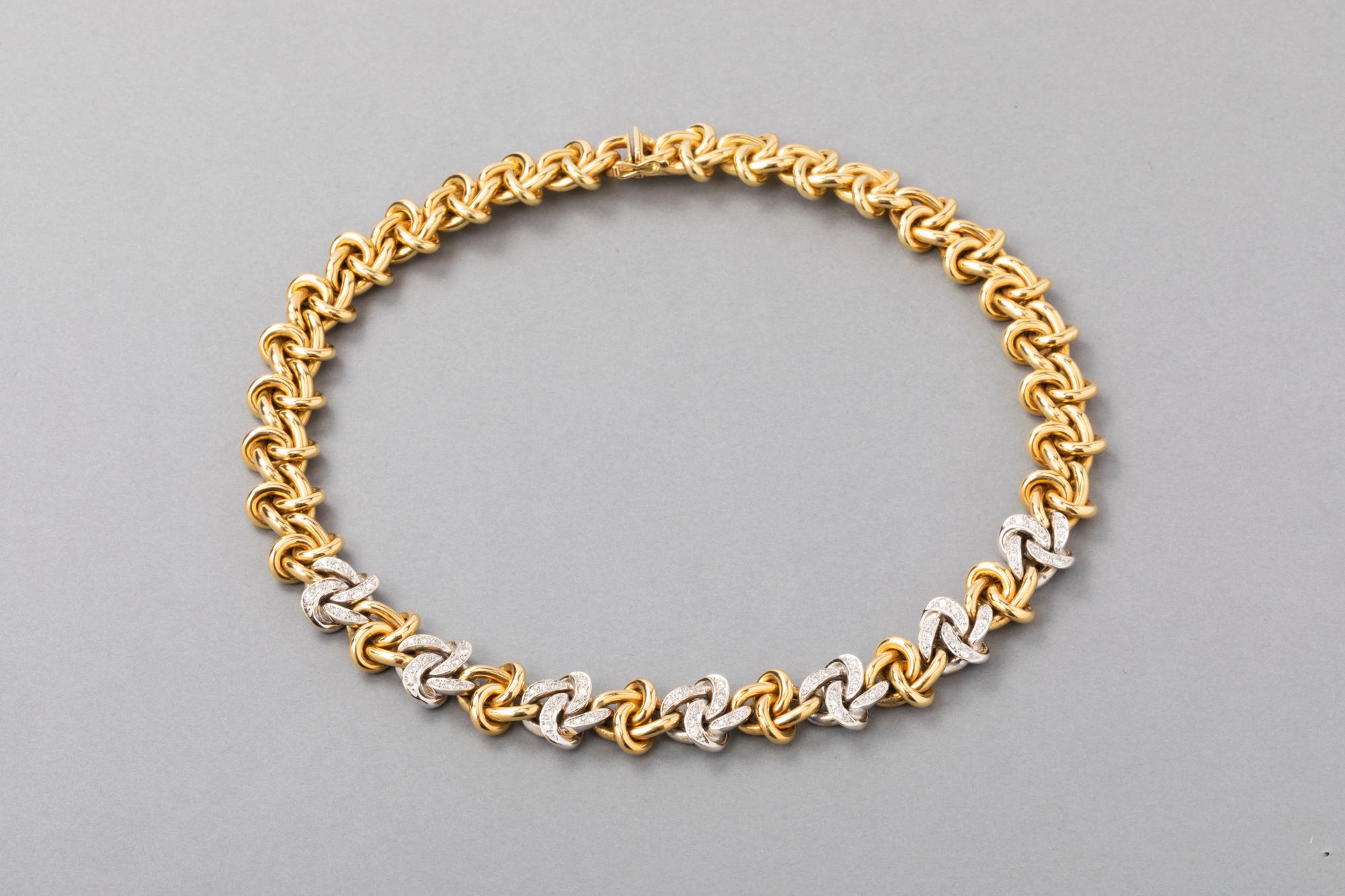 Gold and Diamonds Fashion Necklace

Beautiful necklace, made in France circa 1980.  
Marks fort gold 750. Mounted in yellow gold 18k and diamonds.  
The diamonds weights 1.5 carats estimate. 
The necklace is heavy, this is a sign of good quality, it