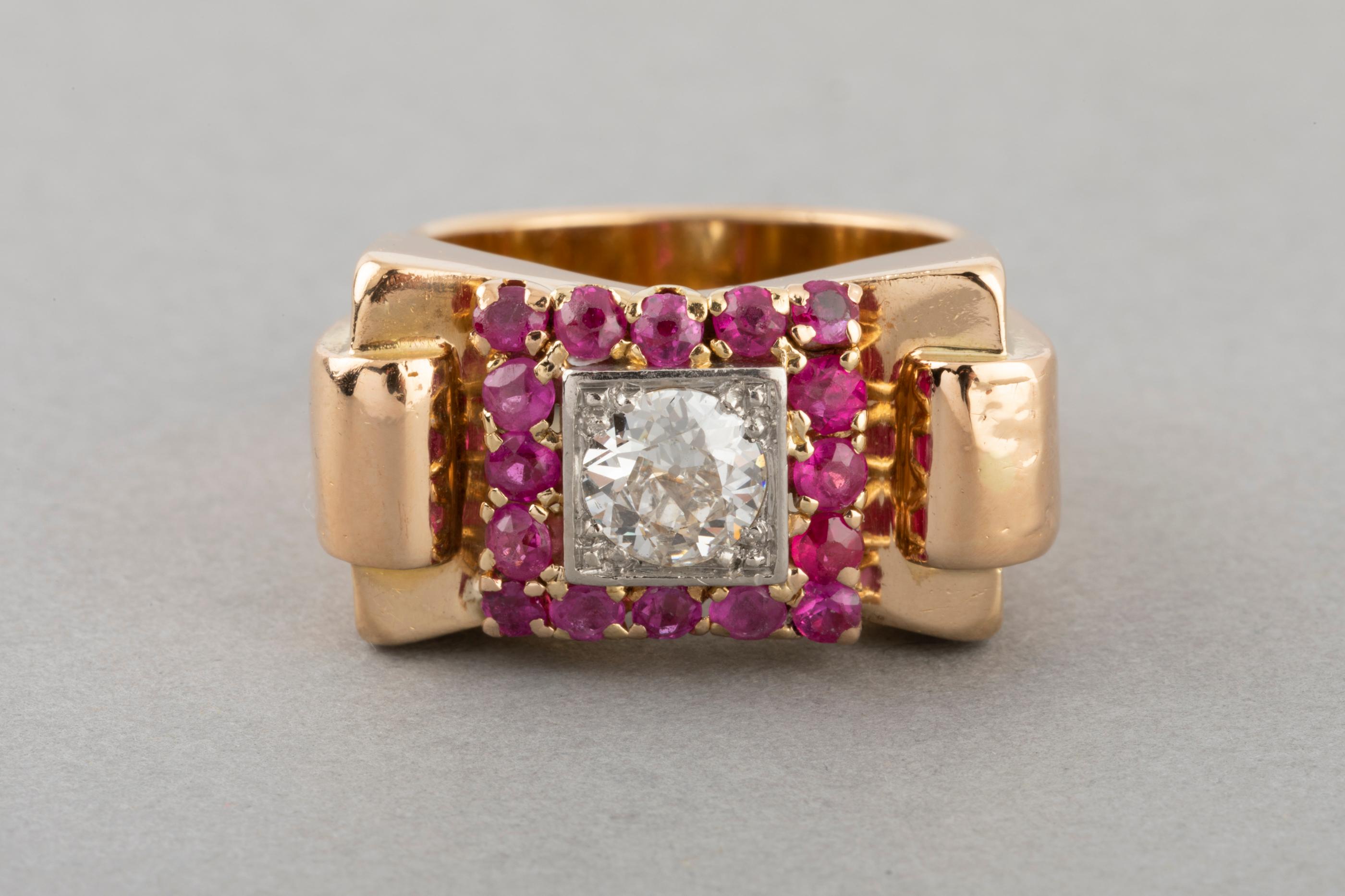 Gold and Diamonds French Retro Ring  
Very beautiful ring, made in France in the 1940's. The design is still fashion and modern. Made in yellow gold 18k, platinum, diamond and red stones. 
The ring is big and has presence, it weight 9.73 grams. 
The
