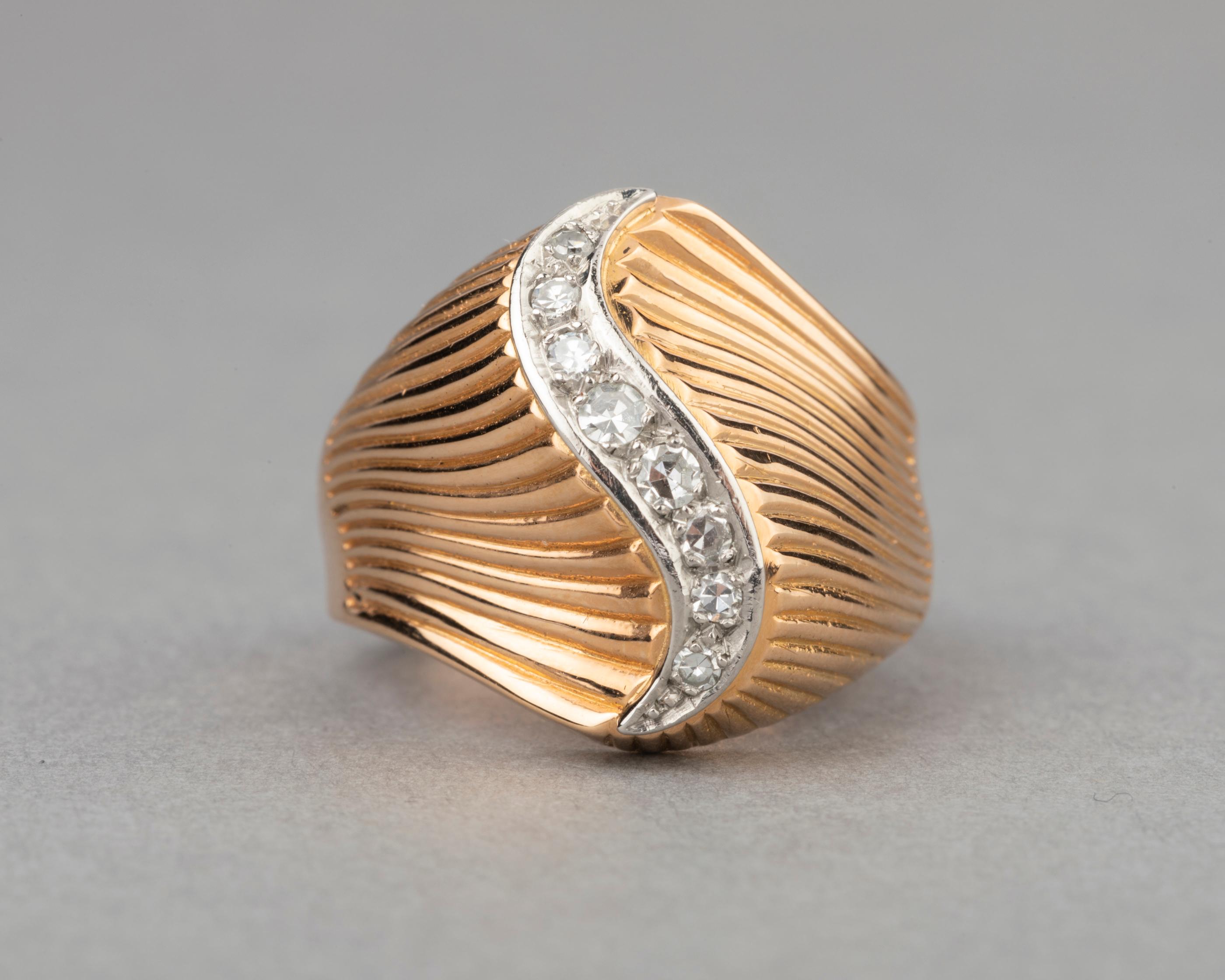 Gold and Diamonds French Vintage Ring

Beautiful ring, made in France circa 1950.
Set with yellow gold 18k and platinum. French marks for gold (eagle head) and platinum (dog head).
The diamonds weights O.40 carats estimate.
Ring size 52.5 or 6.25