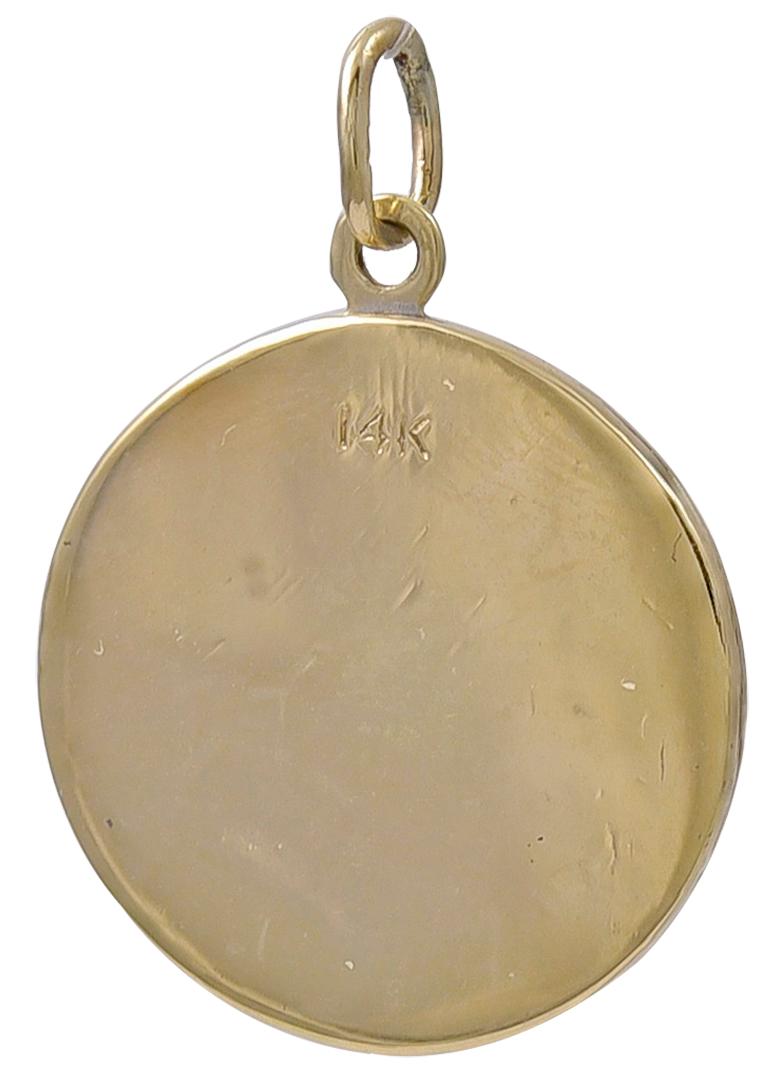 Round charm, with applied letters that spell out 
