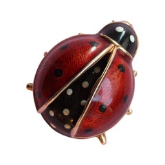 Broche coccinelle en or et émail