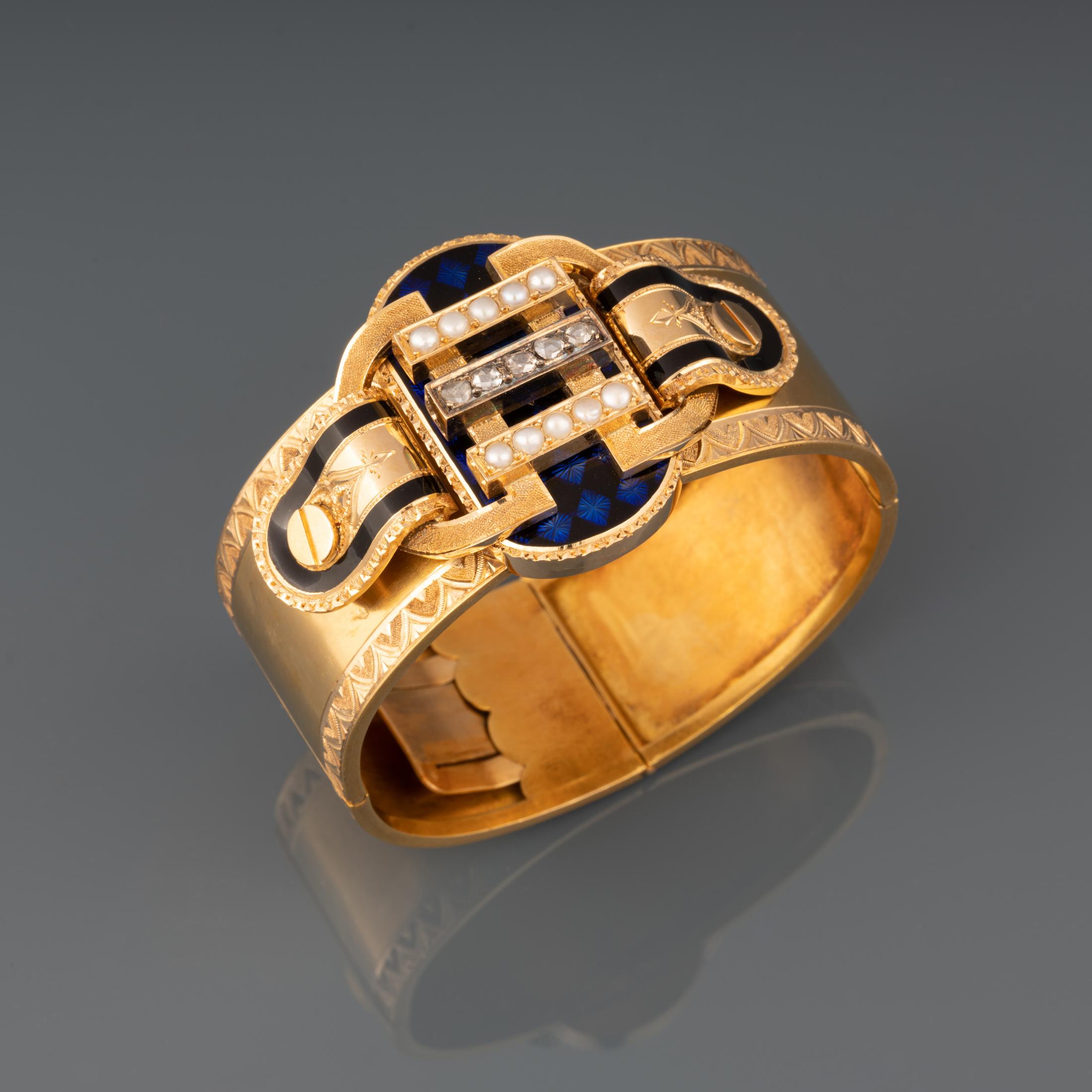 A very beautiful antique bracelet, made in France circa 1850. Made in yellow gold 18l, set with diamonds and pearls, painted with blue and black enamel.

French hallmarks for gold 18k: eagle head and Rhino head. Hallmark of maker (Unknown).

The