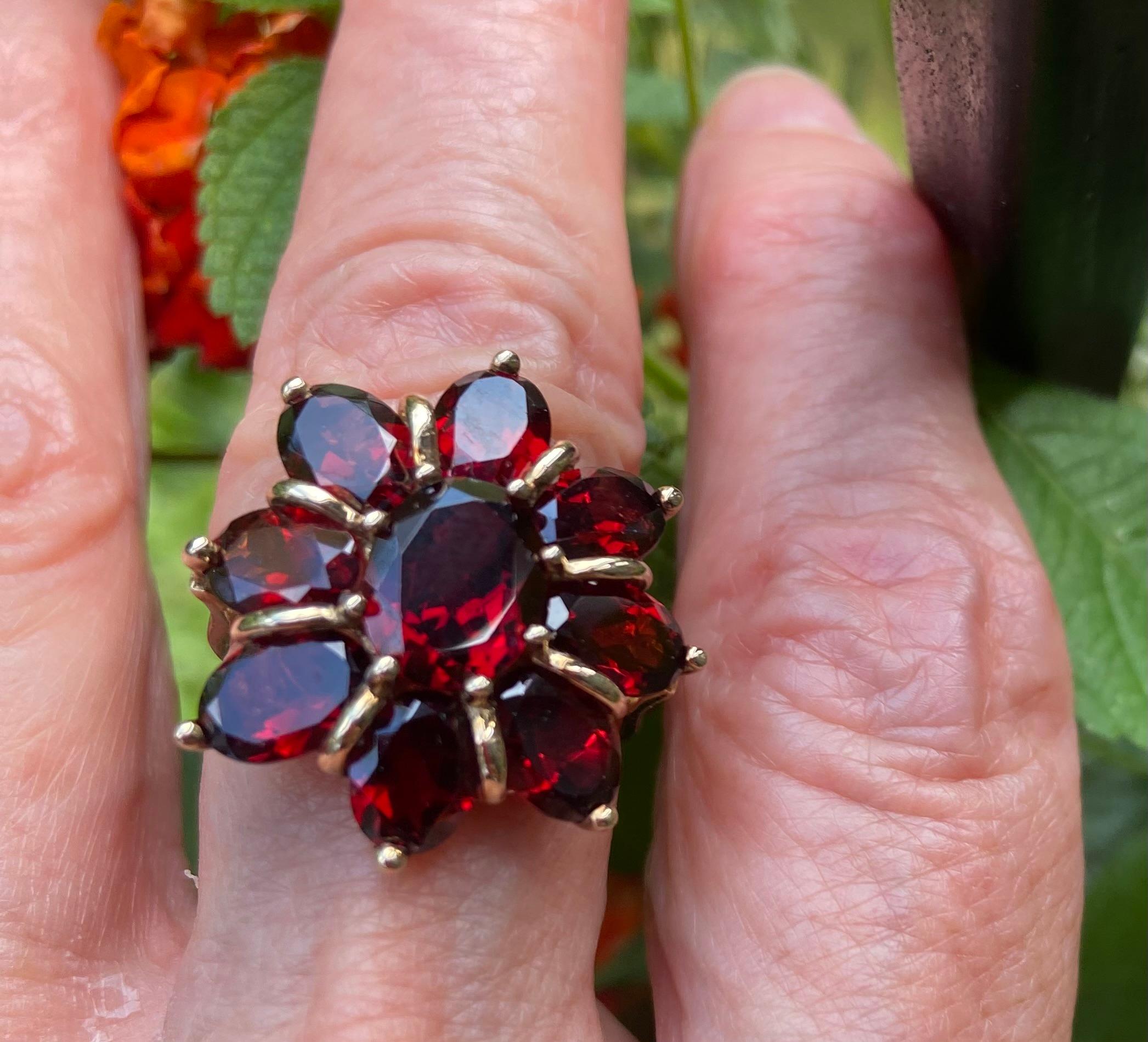 The garnets set in this ring radiate with an intense red flame. With untouched photographs when a jewel is so impressive, you can believe what you see. The gold settings beautifully enhance the stones. They wrap them but do not overwhelm. I put this