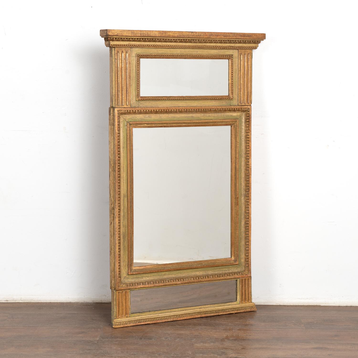 Lovely trumeau mirror painted in soft shades of green, pale red, and gold.
At just under 4' tall, its size allows it to be displayed in a wide variety of spaces.
In solid condition ready to be hung and enjoyed.
All scratches, cracks, dings, nicks,