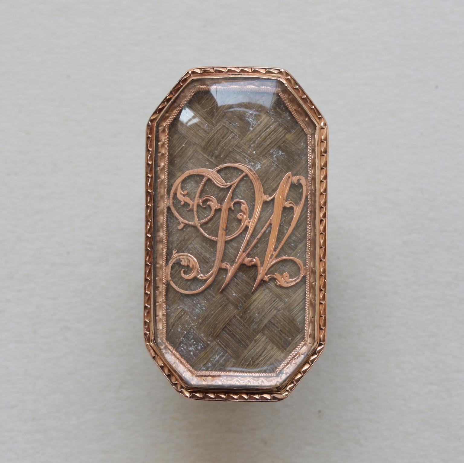 Gold Mourning Ring with the Initials JW Over Braided Hair 1