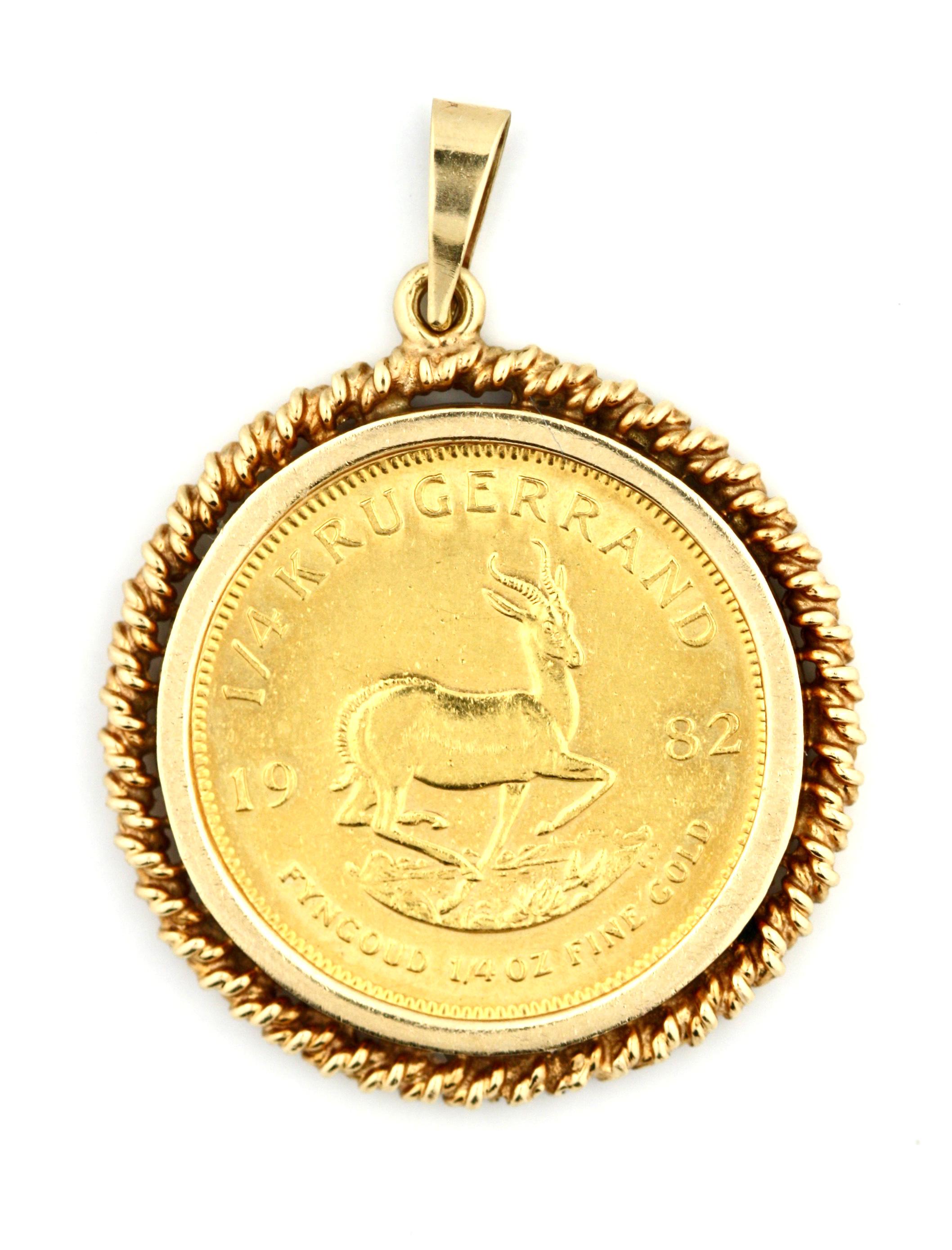 Gold and KRUGERAND Coin Pendant
Centered with a 1/4 South African Gold KRUGERAND within a decorative gold frame,
dated 1982
coin is a 1/4 ounce of fine gold
gross weight approximately 12 grams
length measuring approx. 29mm excluding hoop