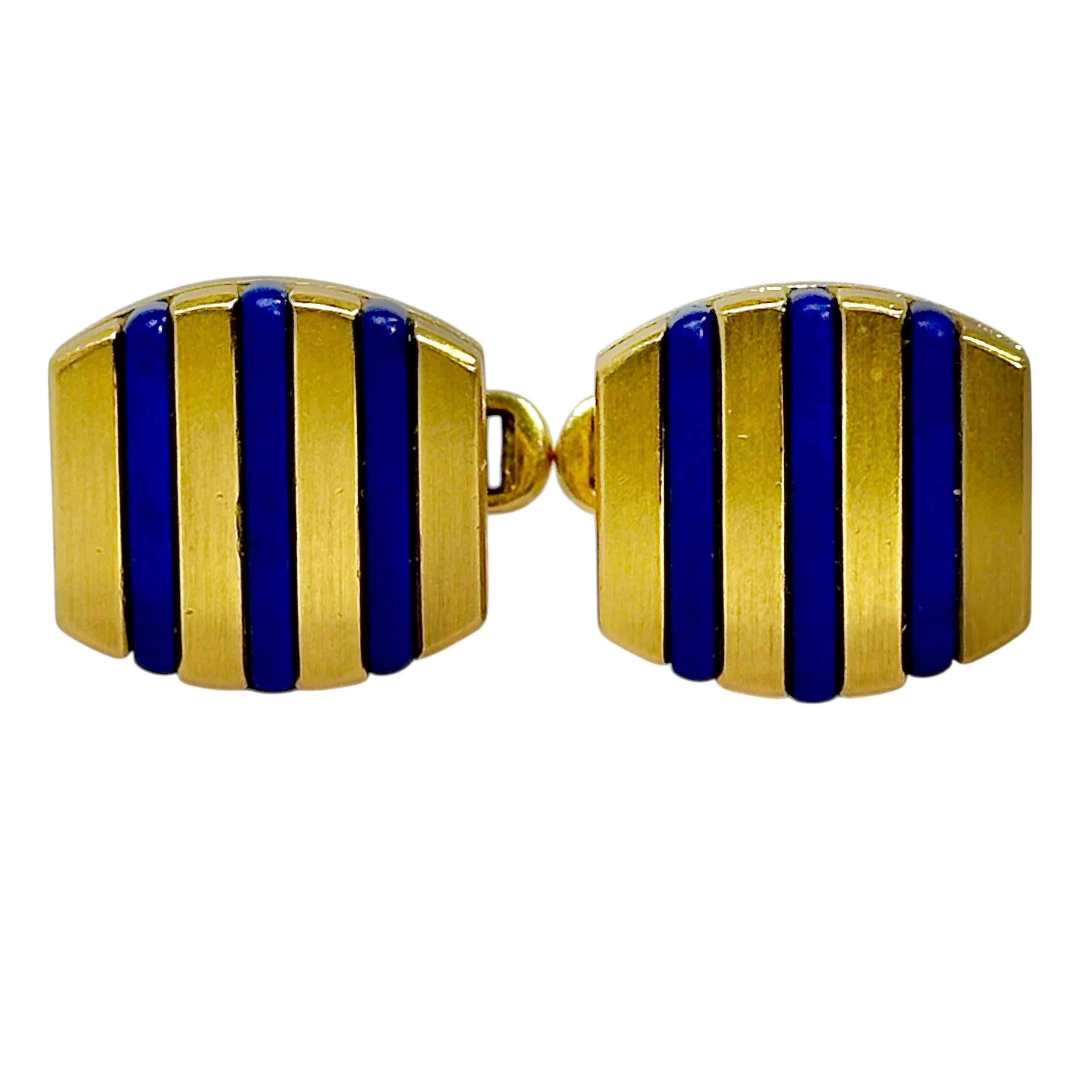 A tailored pair of 18 karat yellow gold, cushion shaped, cufflinks. Each cufflink is set with 3 lapis lazuli bars. The deep blue bars contras thandsomely against the rich yellow gold. Measures just under 3/4 of an inch long. Signed A.B.L. 18K. Gross