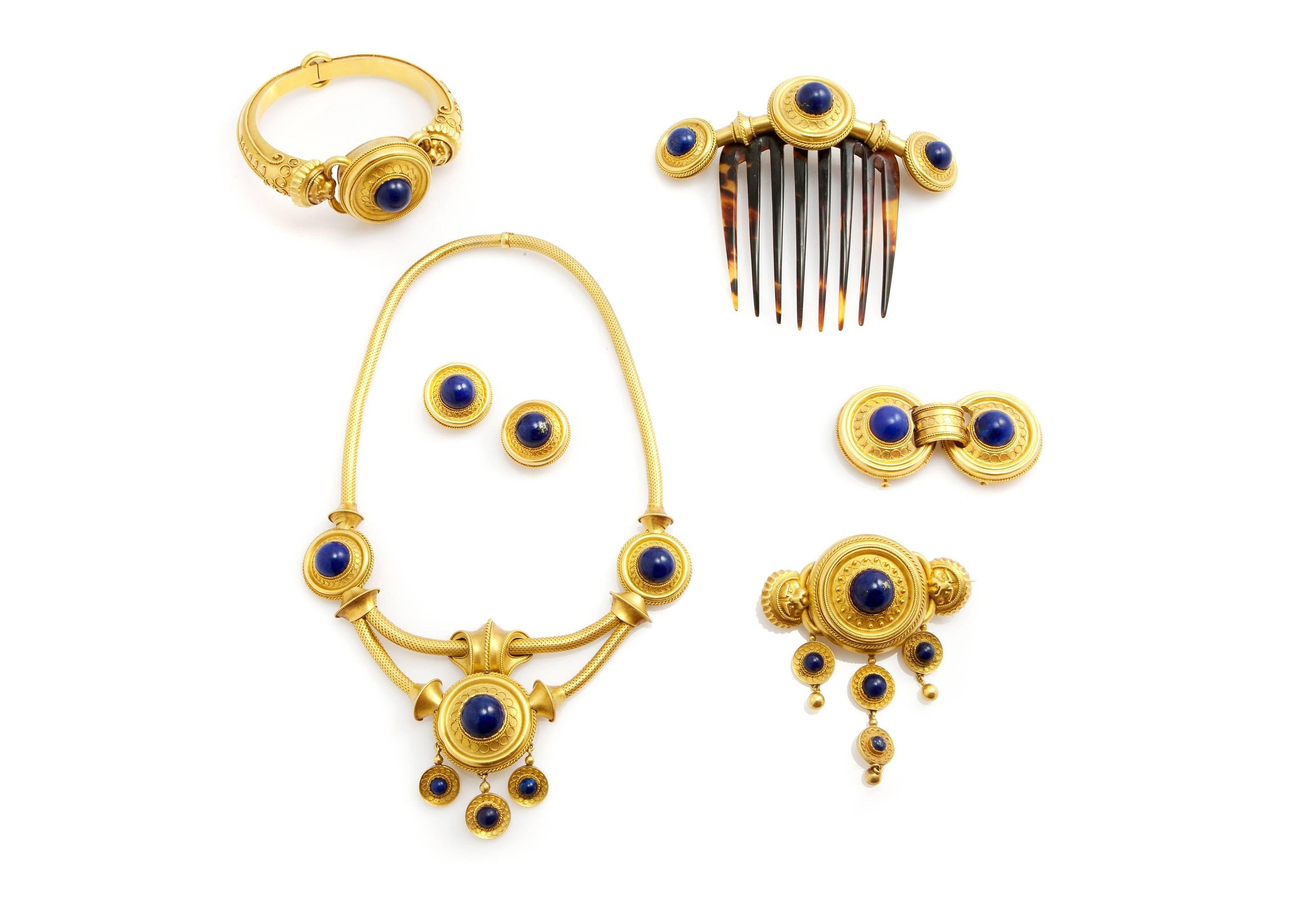 This unique and beautiful parure is set in  18ct yellow gold  with lapis lazuli and it was made in France around 1870 (Napoleon III), in the Etruscan style (archaeological revival)
It includes:
1. bangle 46.68g, 30mm x 20mm x 60mm inner diameter
2.