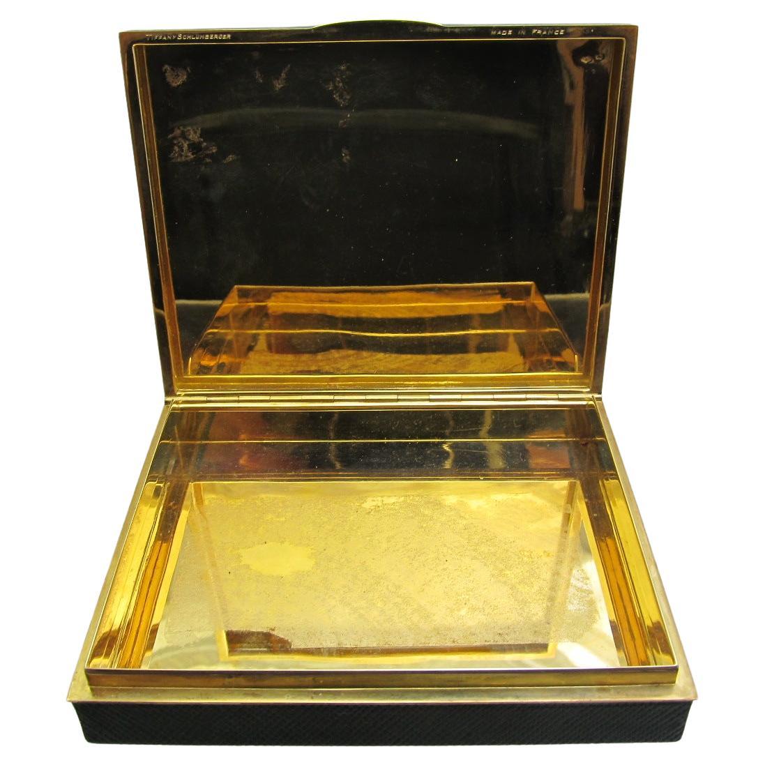 18k Yellow Gold And Leather Case, J. Schlumberger For
Tiffany & Co. The Gold Case Clad In Green Leather, Gross
Weight 96.7dwt., Made In France Box
Measuring 3 7/8 By 3 1/4 By 3/4 Inches.