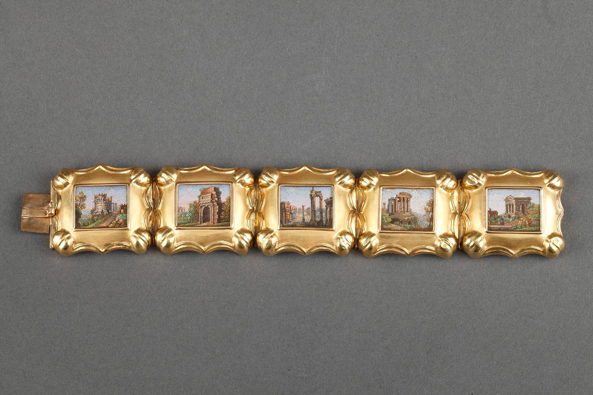 Articulated bracelet composed of five micromosaic medallions framed in sculpted gold. The micromosaic plates represent views of various famous Roman monuments. 

Length 6.7 in (17 cm) 

First half of the 19th century work.