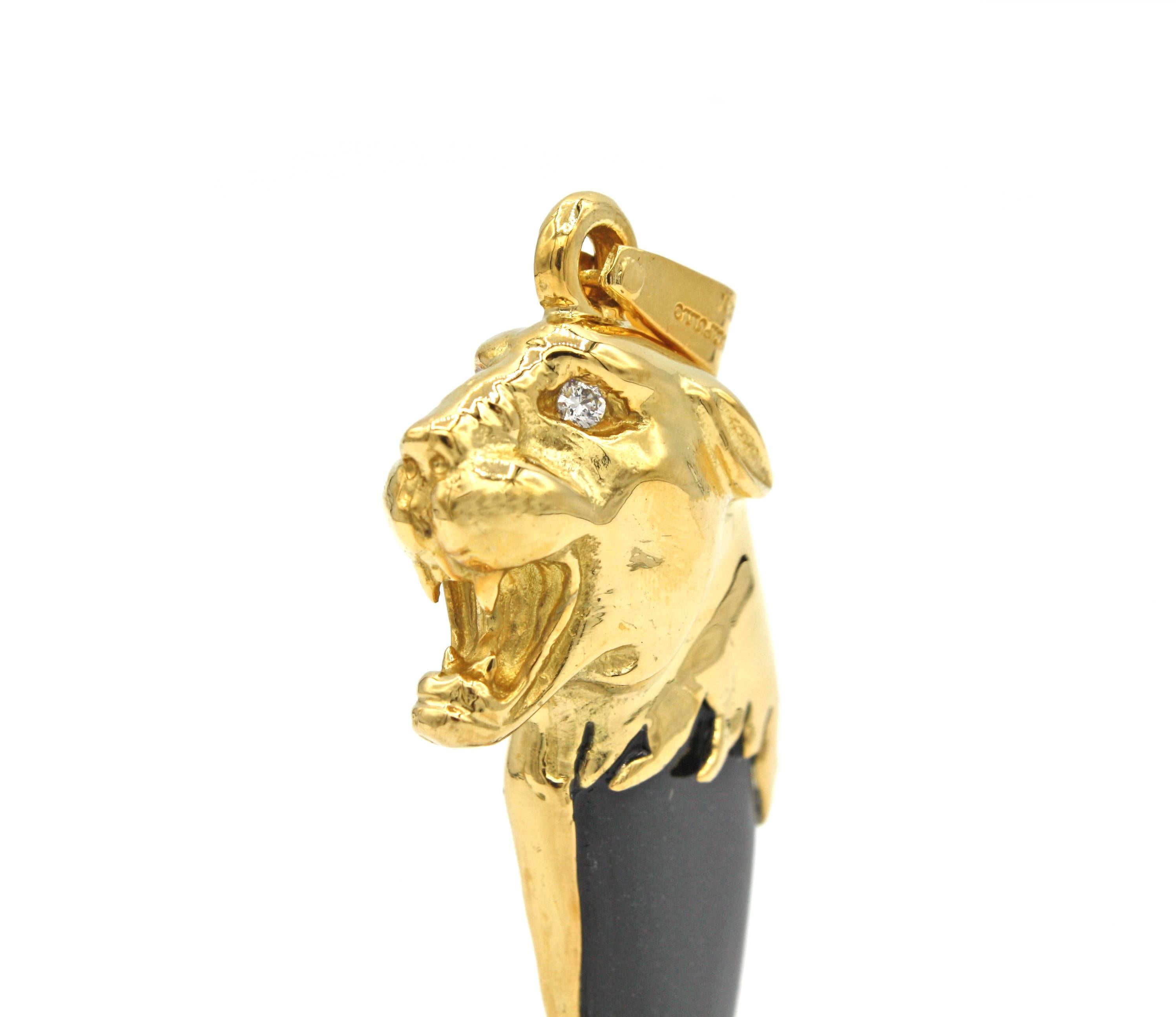This unique pendant features an 18 kt yellow gold tiger head with .15ct diamond (G color, VS clarity) eyes and Black Onyx 