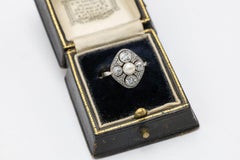 Gold and platinum ring with diamonds and a cultured pearl, circa 1920