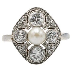 Gold and platinum ring with diamonds and a cultured pearl, circa 1920