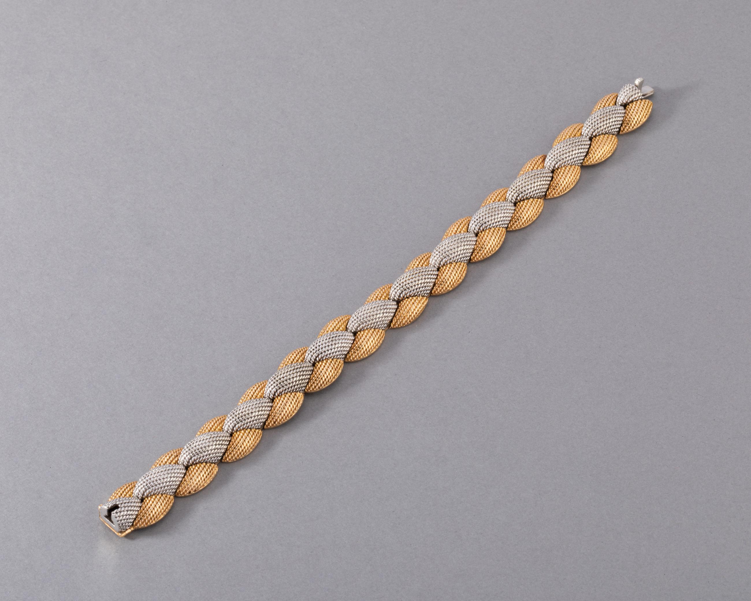 One lovely vintage bracelet, made by great maker Pierre Sterlé.
Made in France circa 1960. Made in yellow gold 18k and platinum. Signed Sterlé PARIS
The length is 18 cm.
14 mm width. 
Total weight: 82.90 grams