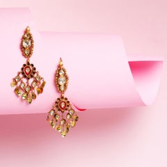 Gold and polki ear rings with red inlay by Vintage intention