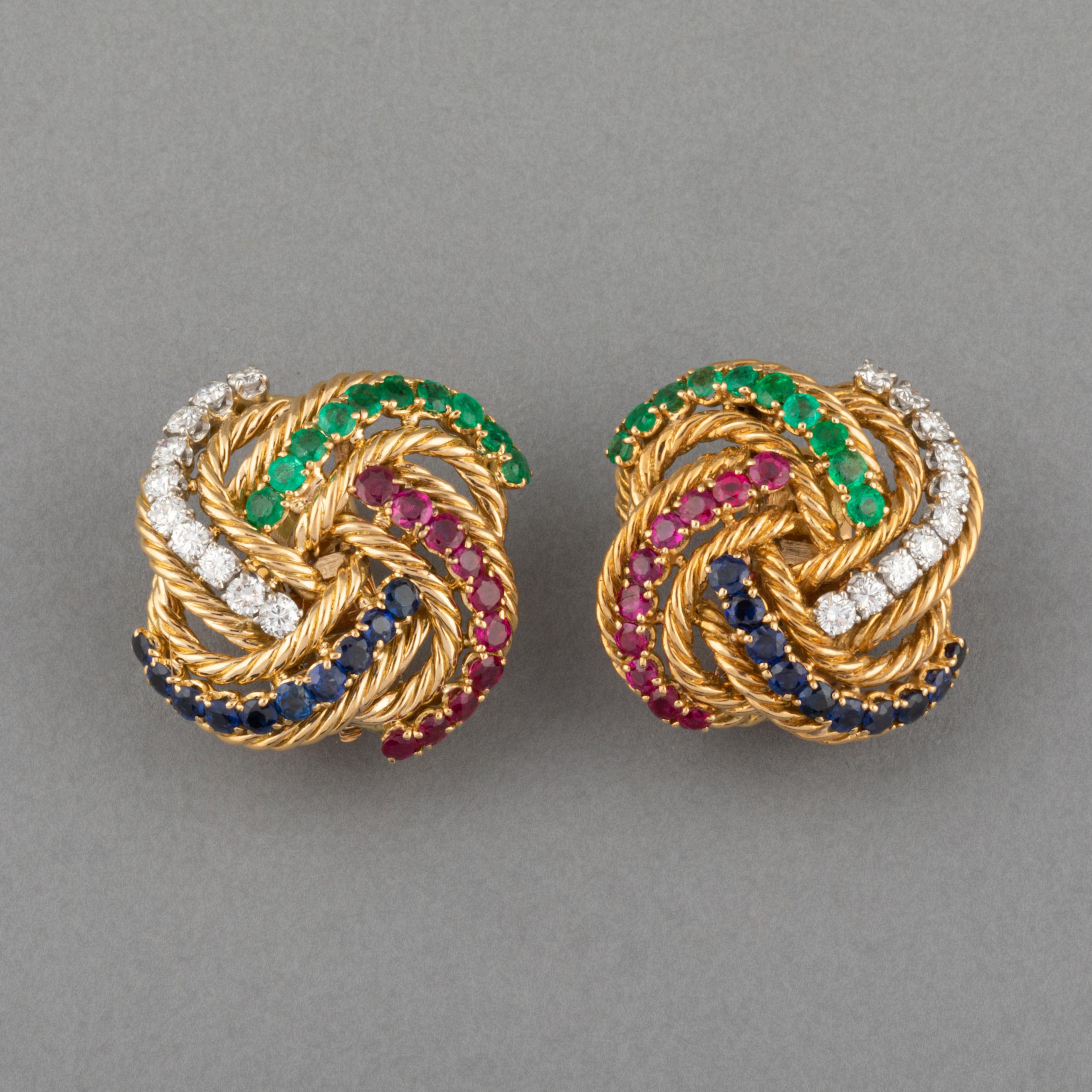 A lovely pair of vintage Boucheron Earrings made in France circa 1960.

Made in yellow gold 198k. Set with diamonds, sapphires, rubies and emeralds.

Dimensions: 24mm 

Weight: 25 grams