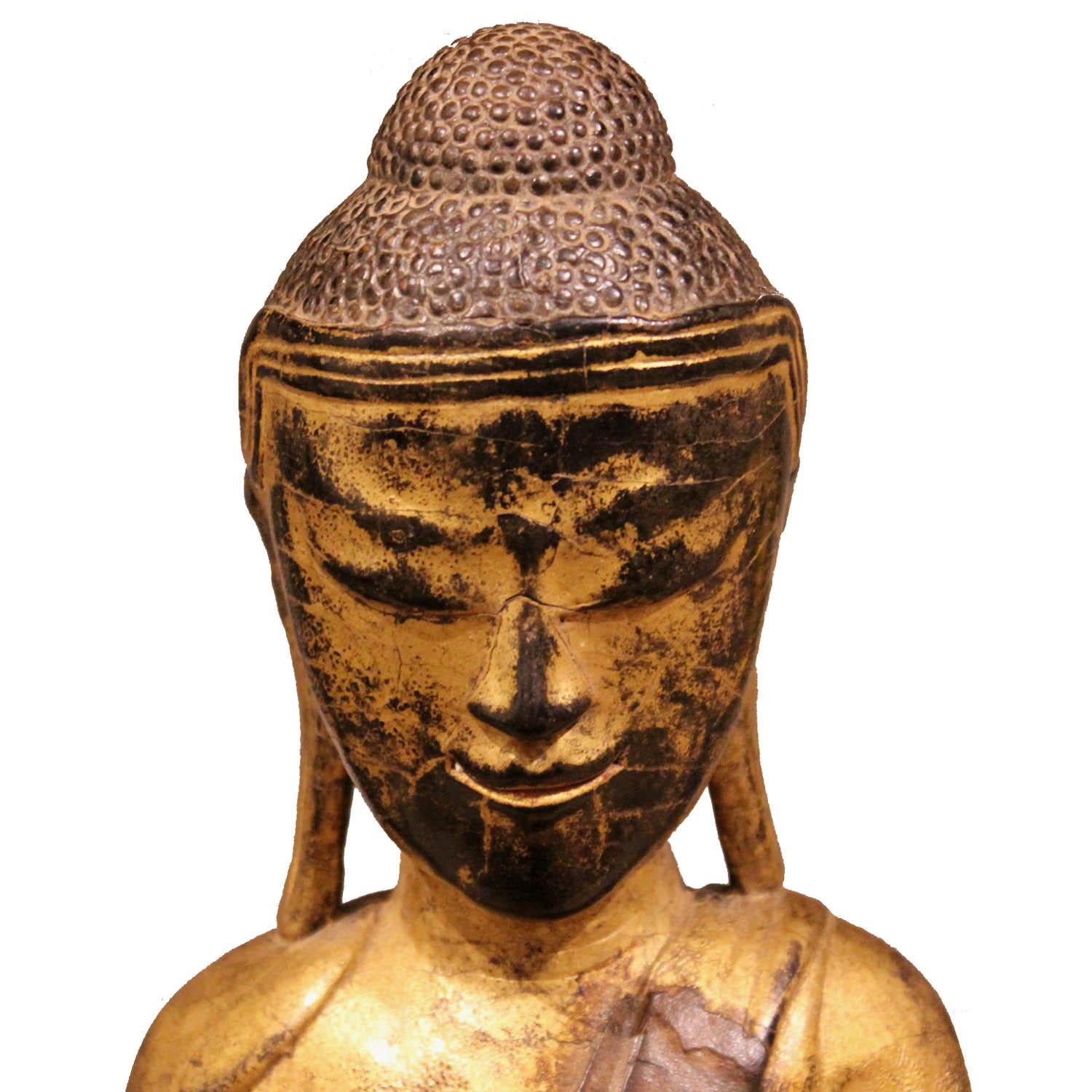 Vintage gold-leaf and red lacquer sitting monk from Burma with touching the earth mudra, praying for the fulfillment of all wishes.