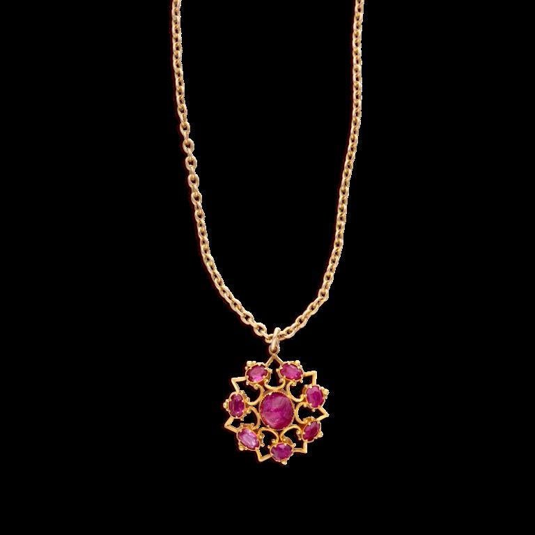 Featuring cabochon rubies. 
- Rubies weighing a total of approximately 15.00 carats 
- 14 karat yellow gold
 - Total weight 18.80 grams 
- Necklace length 28 inches 
- Pendant length 1 1/2 inches, width 1 inch