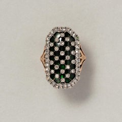 gold and silver bague au firmament with green glass and diamonds