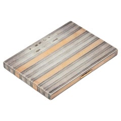 Gold and silver cigarette case with raised bands Gold and silver cigarette case with raised bands