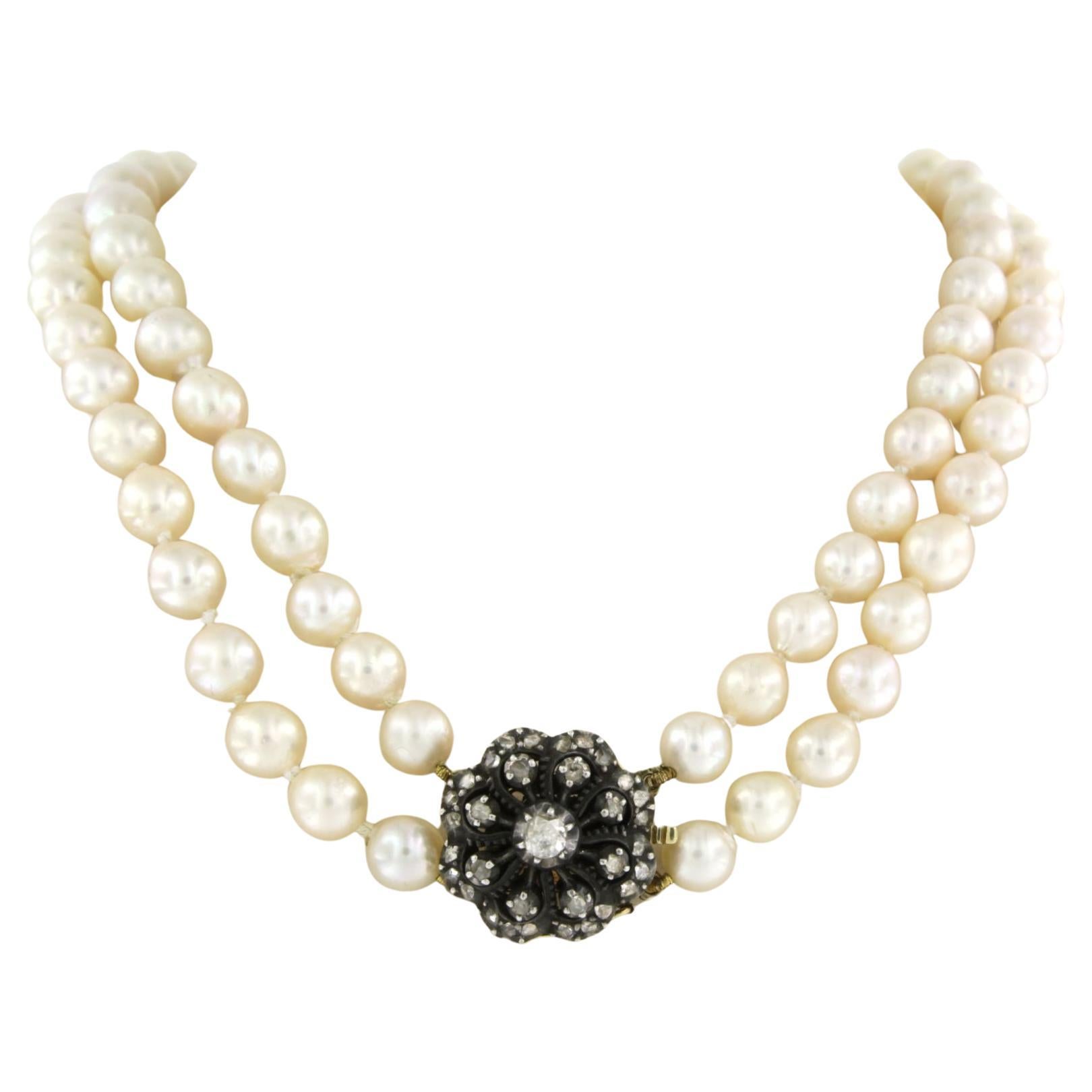 Gold and silver lock set with diamonds on a pearl bead necklace For Sale