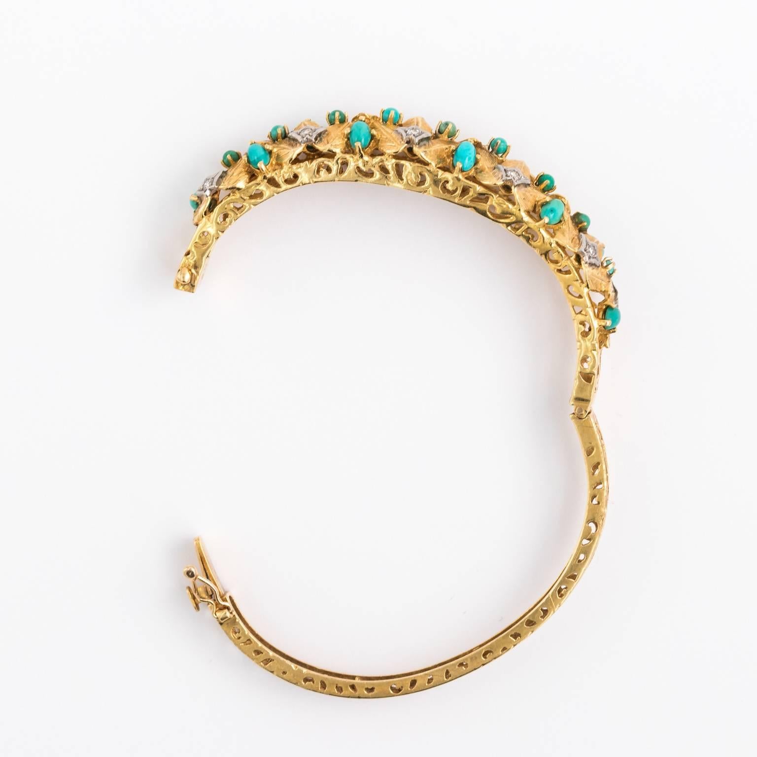 Circa 1950s 18 karat gold cuff bracelet with approximately two carats of Turquoise and 20 pts. of medium diamonds. Detail is etched gold leaf interspaced with stones. Clasp includes a safety catch.
