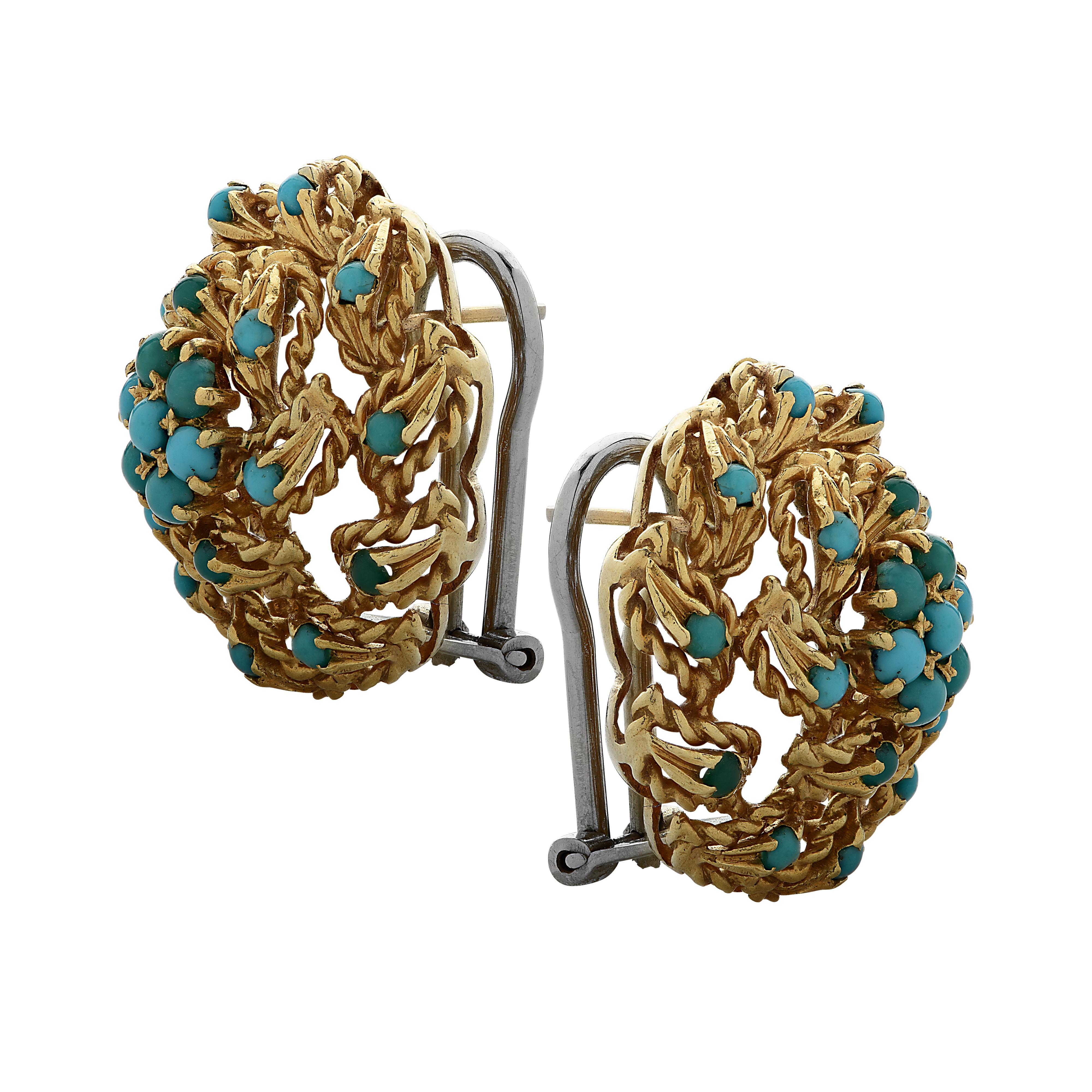 Beautiful stud earrings crafted in 18 karat yellow gold with turquoise cabochons. Turquoise cabochons arranged in a flower rest in the center of twisted gold leaves clustered together, swirling outwards, with turquoise cabochons sprinkled on the