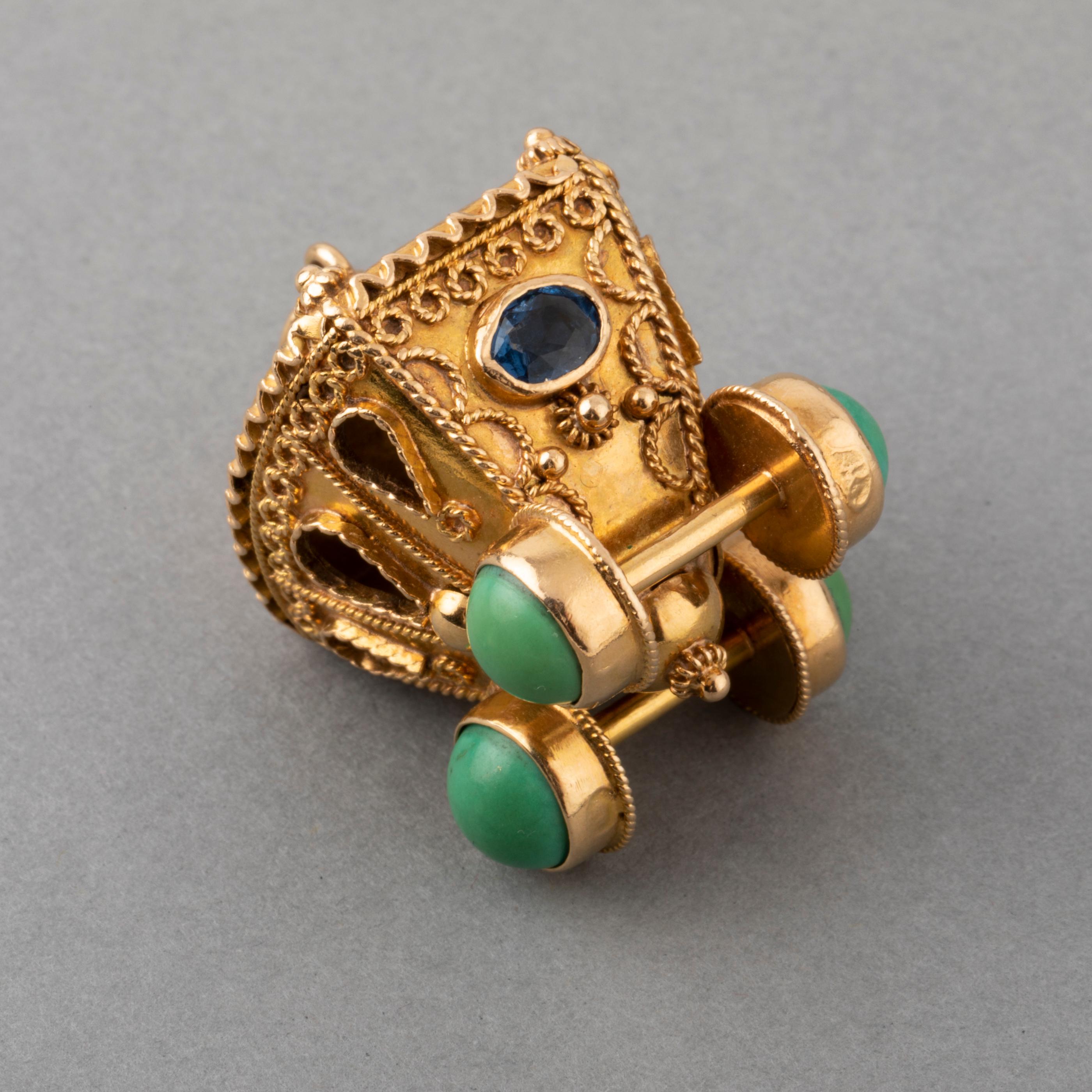 Gold and Turquoise Vintage Charm

  Very beautiful charm, made in Italy circa 1960. Made in yellow gold 18k (mark for gold). I controlled the gold in Paris so they have French marks (the owl)
The condition is good. The design is a coach, very