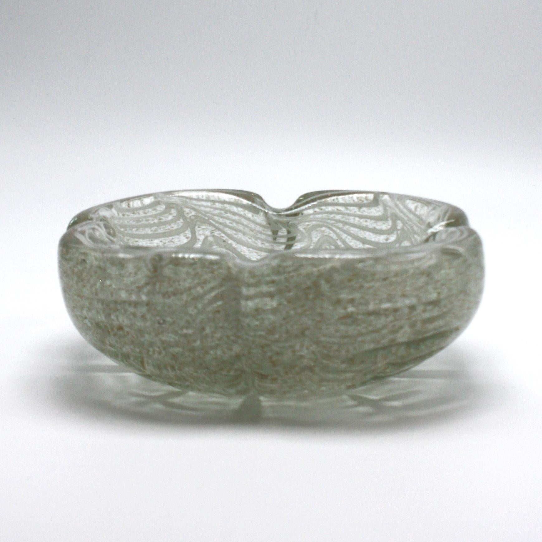 Gold and white Murano glass bowl, circa 1950.
Measures: 6 1/2” diameter x 2” height.
