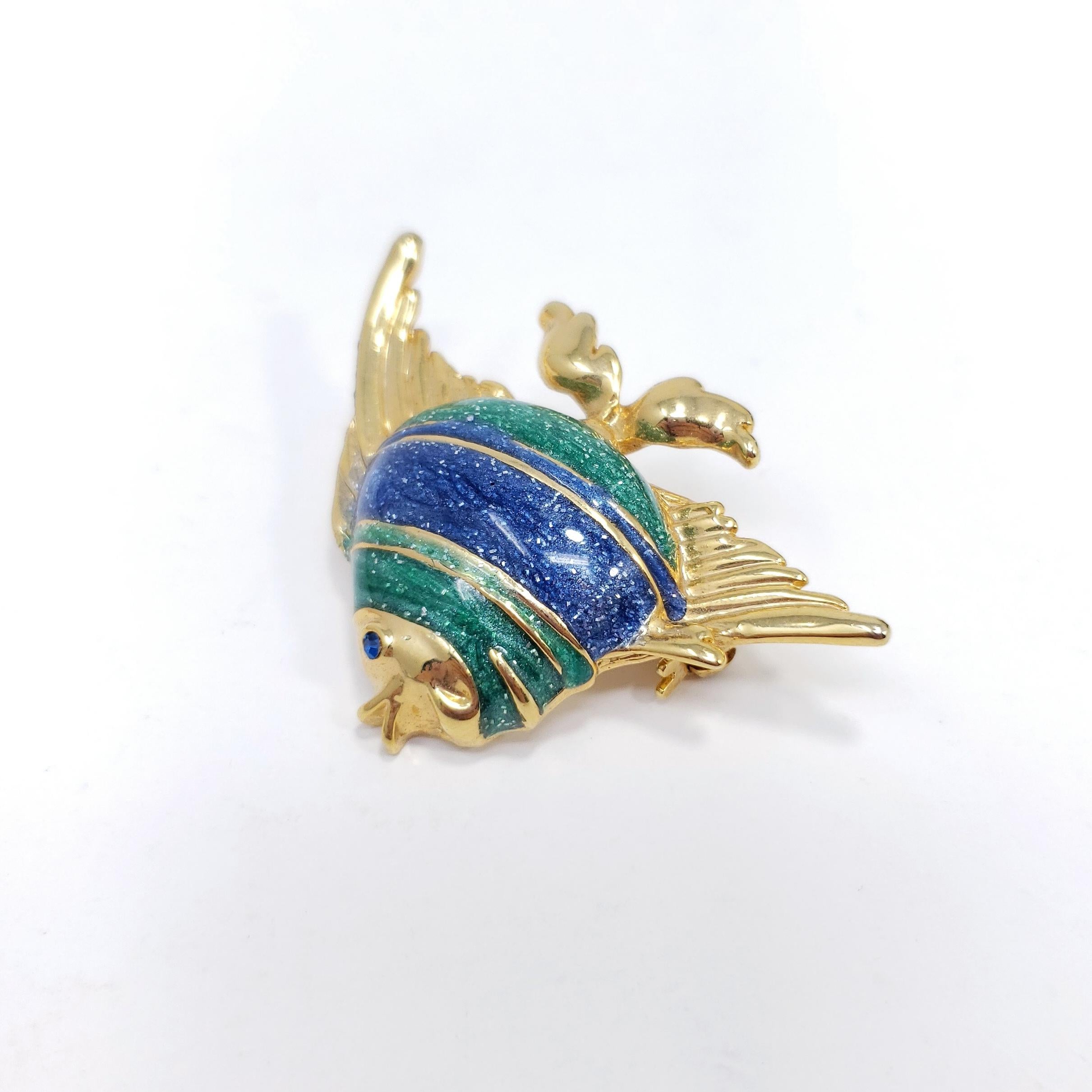 A stylish vintage pin brooch, featuring a vibrant angel fish decorated with green and blue enamel.

Goldplated.

Circa late 1900s.
