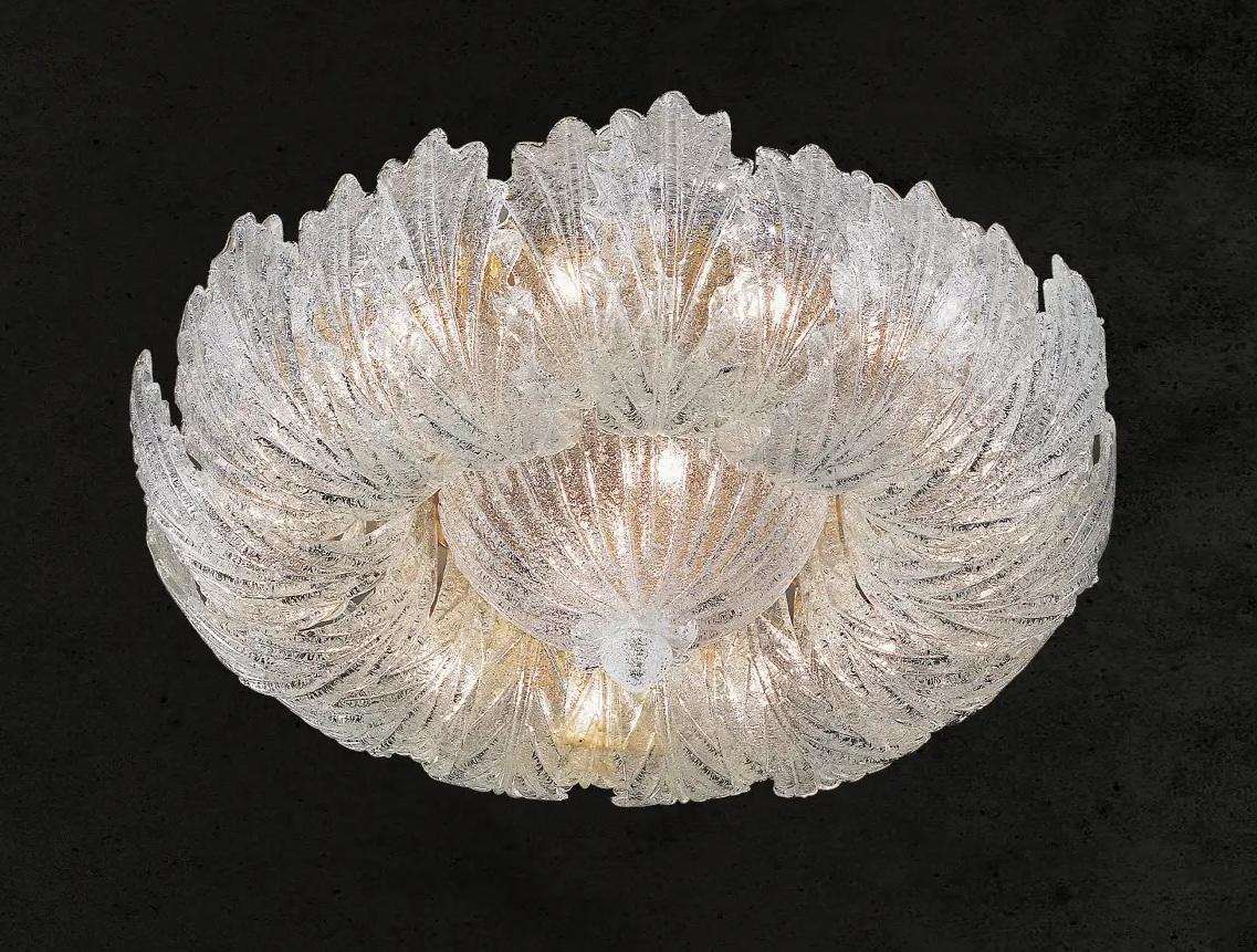 Italian flush mount with clear Murano glass leaves hand blown in Graniglia technique to produce a granular textured effect, mounted on gold finish metal frame by Fabio Ltd / Made in Italy
15 lights / E26 or E27 type / max 60W each
Measures: Diameter