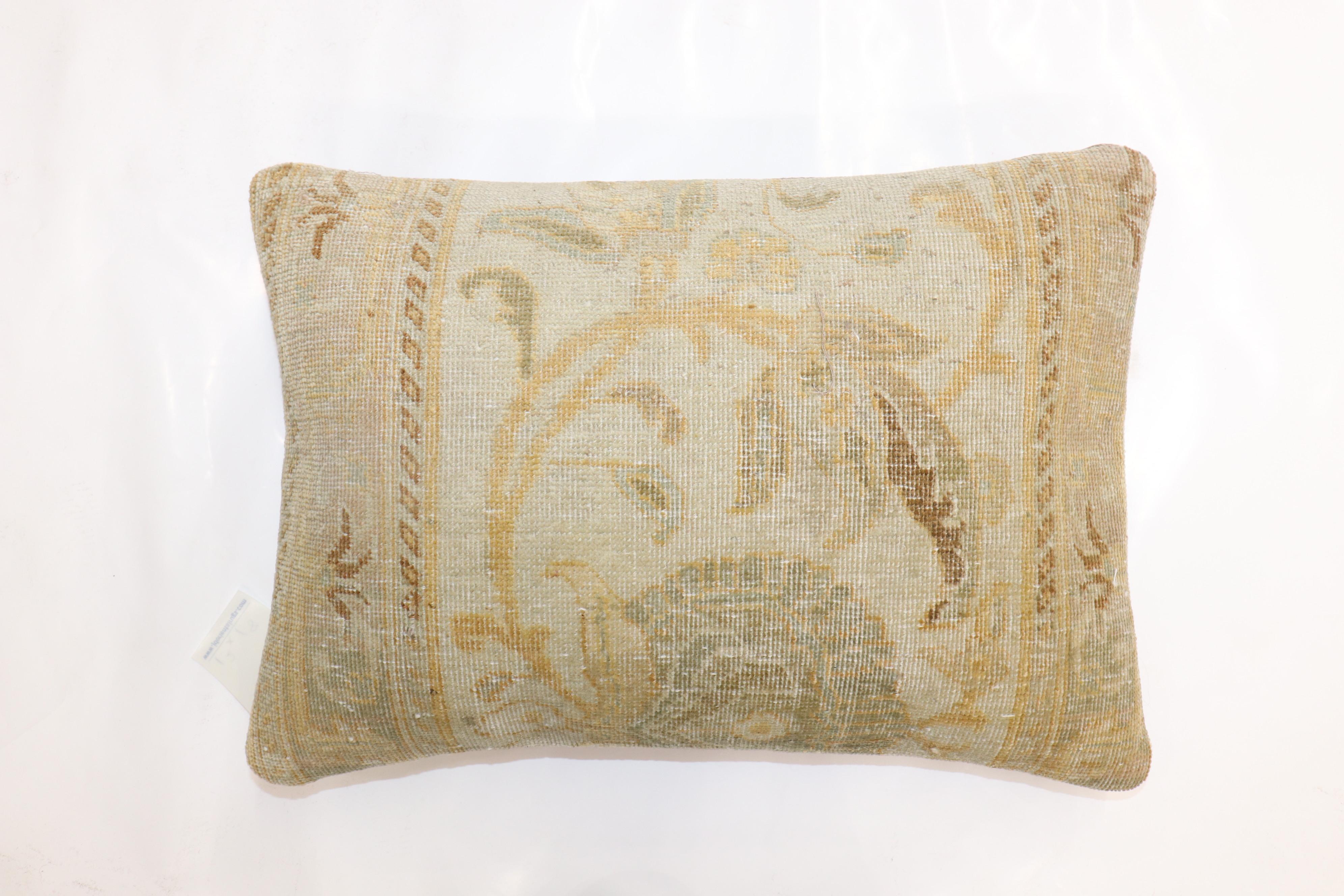 Bolster size pillow made from a finely woven gold color persian tabriz rug.

Measures: 14'' x 20''.