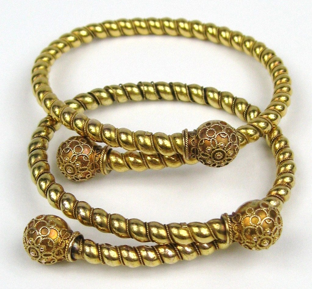 Stunning and you have a matching pair to wear together or one on each wrist. Look at the workmanship on these, stunning! They are hallmarked July 4 1882. Gold Filled. These coil up to fit a tiny wrist up to a 7
