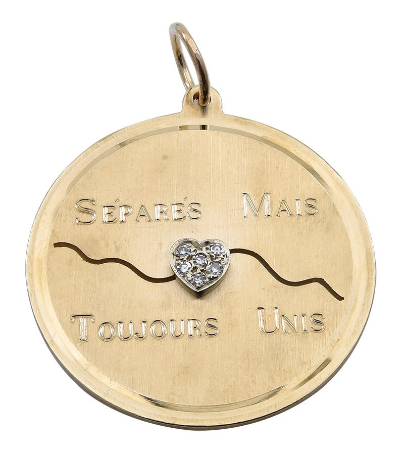 Most endearing large charm:  a round disc with a diamond-encrusted heart in the center.  Above the heart, it is engraved:  