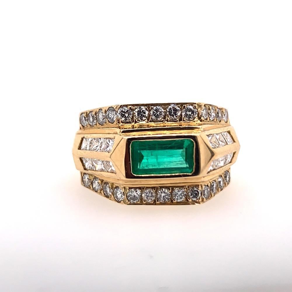 A Magnificent Hand Made 14k Yellow Gold Art Deco Style Ring (size 5.75) set with an approximate 1 carat natural green emerald (estimated Colombian grade) measuring 8x4x2.5mm. Included are 38 natural F-G color and VS-SI clarity diamonds approximately