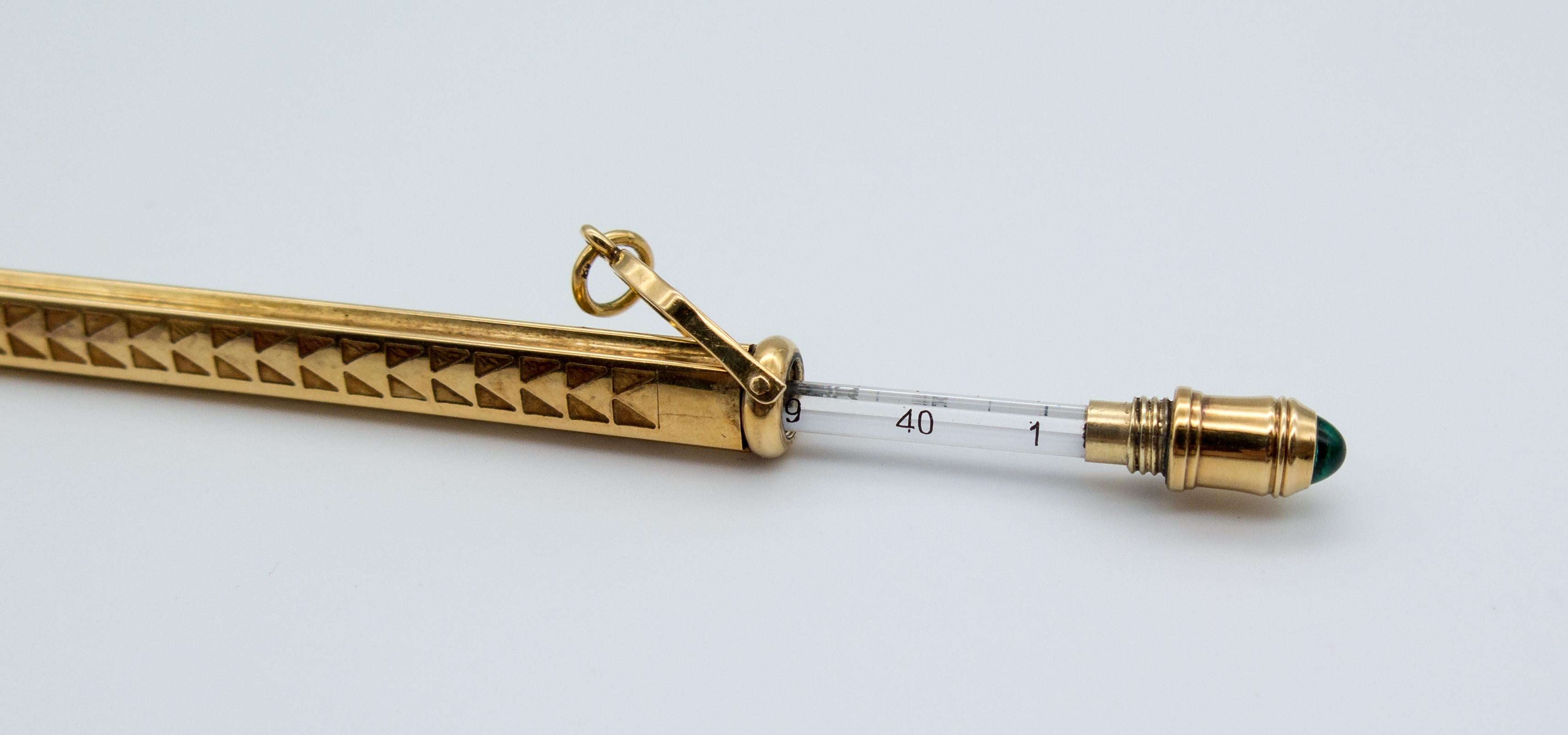A practical object that's also beautiful, this 14 karat gold thermometer (numbers in Celsius, not Fahrenheit)  measures 5 inches in length, including the gold circle at the top.  It unscrews to reveal the thermometer inside.  Please note that within
