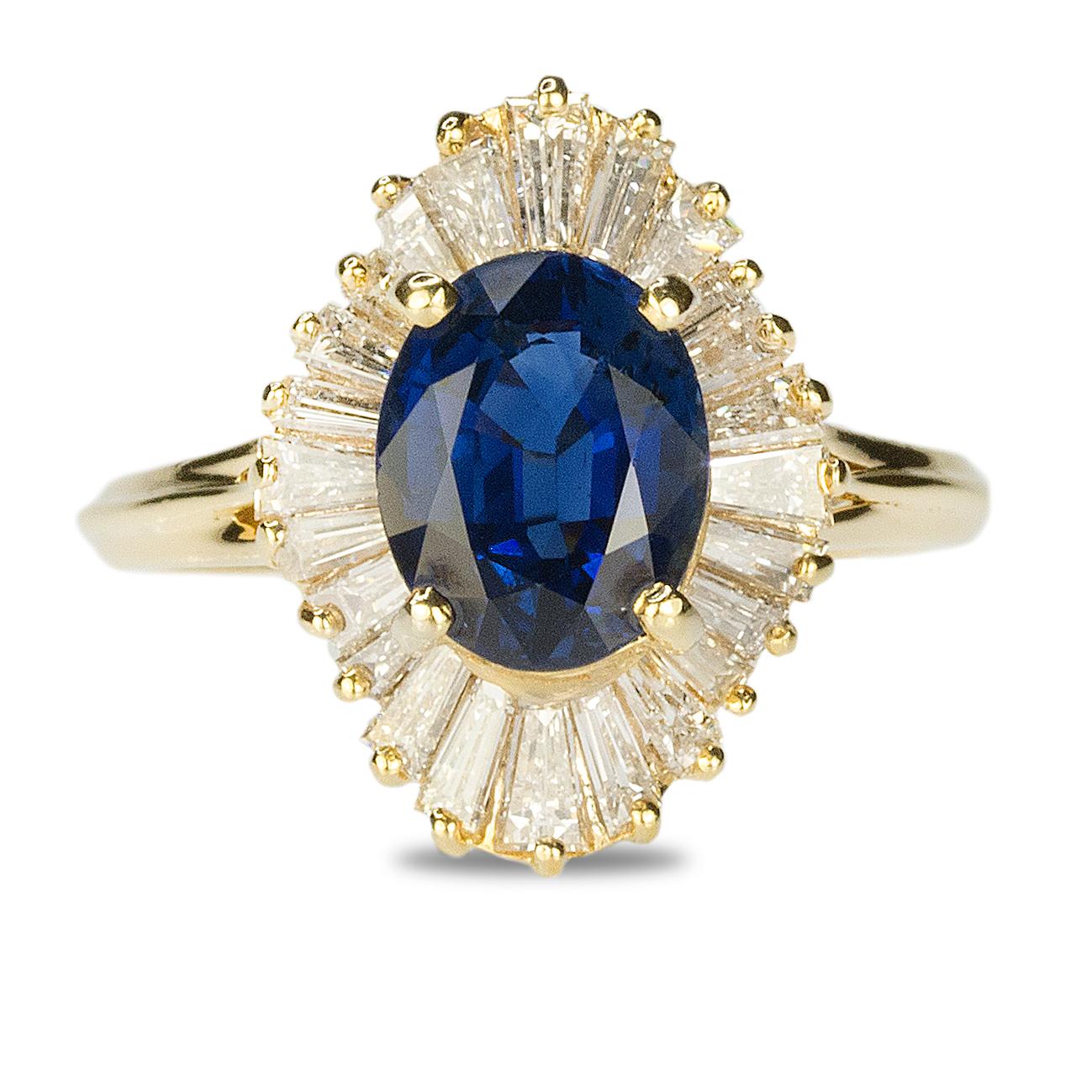 Yellow Gold Ring with approximate 2.70 carat royal blue sapphire and 28 baguette diamonds weighing approximately 1.50 carats. 4.81g