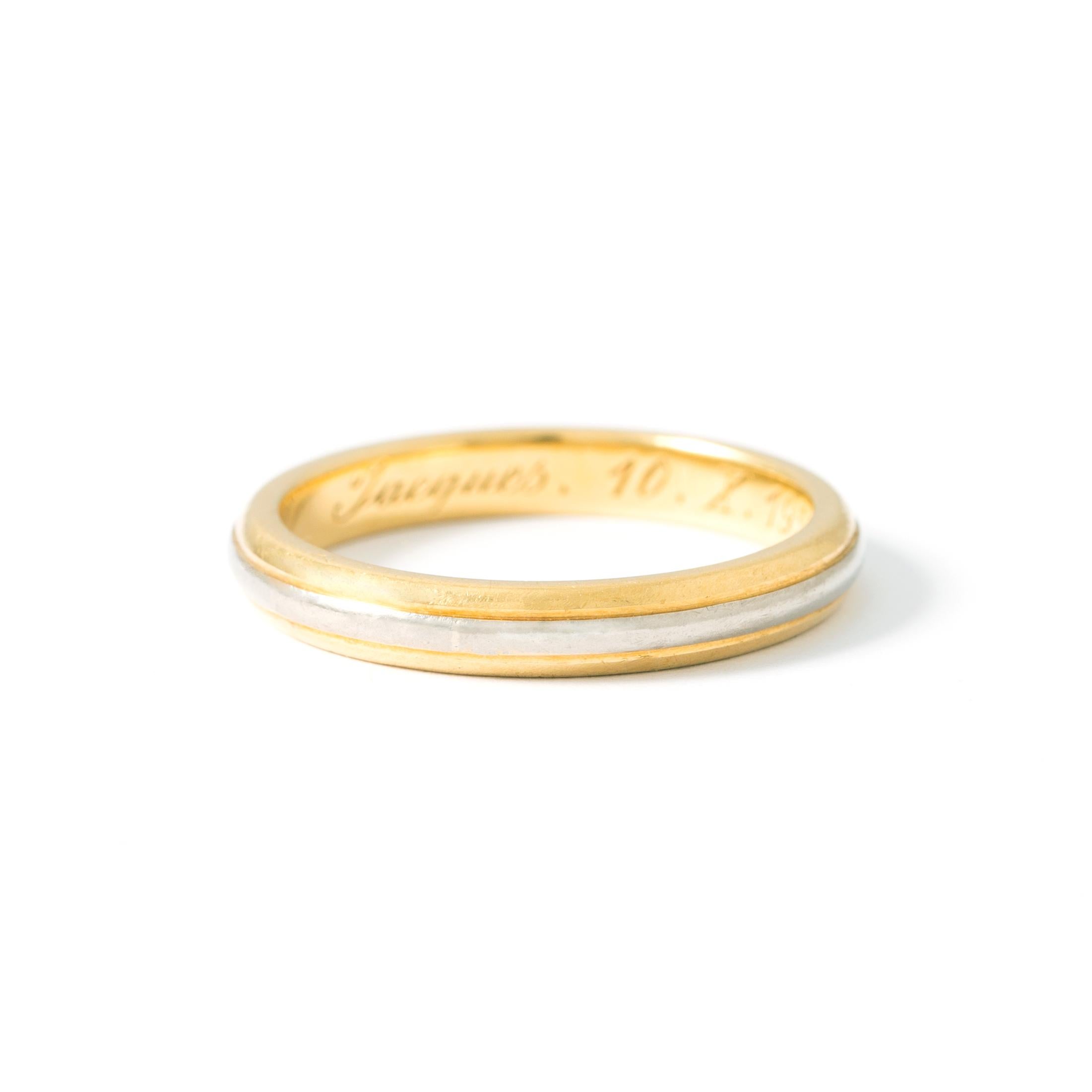 18K yellow and white gold wedding band with interior engraving. Dated 1955.
Finger size: 53.
Total weight 3.96g.
