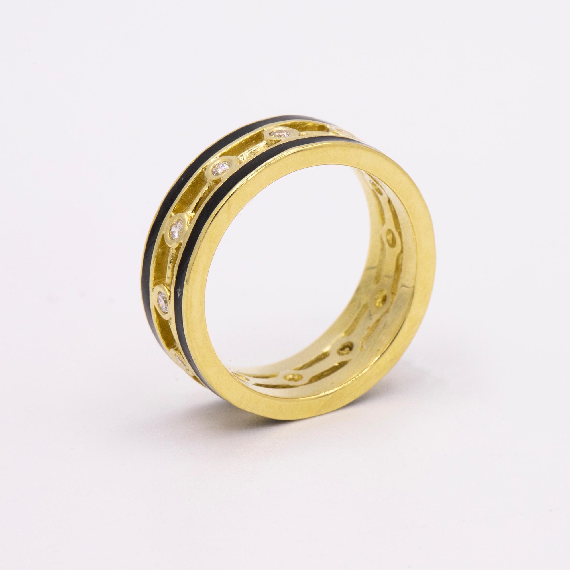 18kt Yellow Gold Band with Black Inlay & 12 Bezel set Diamonds weighing Aprx. .25 carats in total.