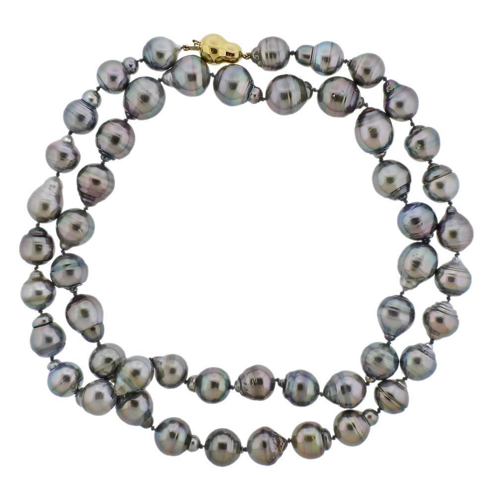 Long necklace with Baroque Tahitian pearls and a 14k gold clasp. Pearls are approx. 12.2 - 15mm.  Necklace is 35.5