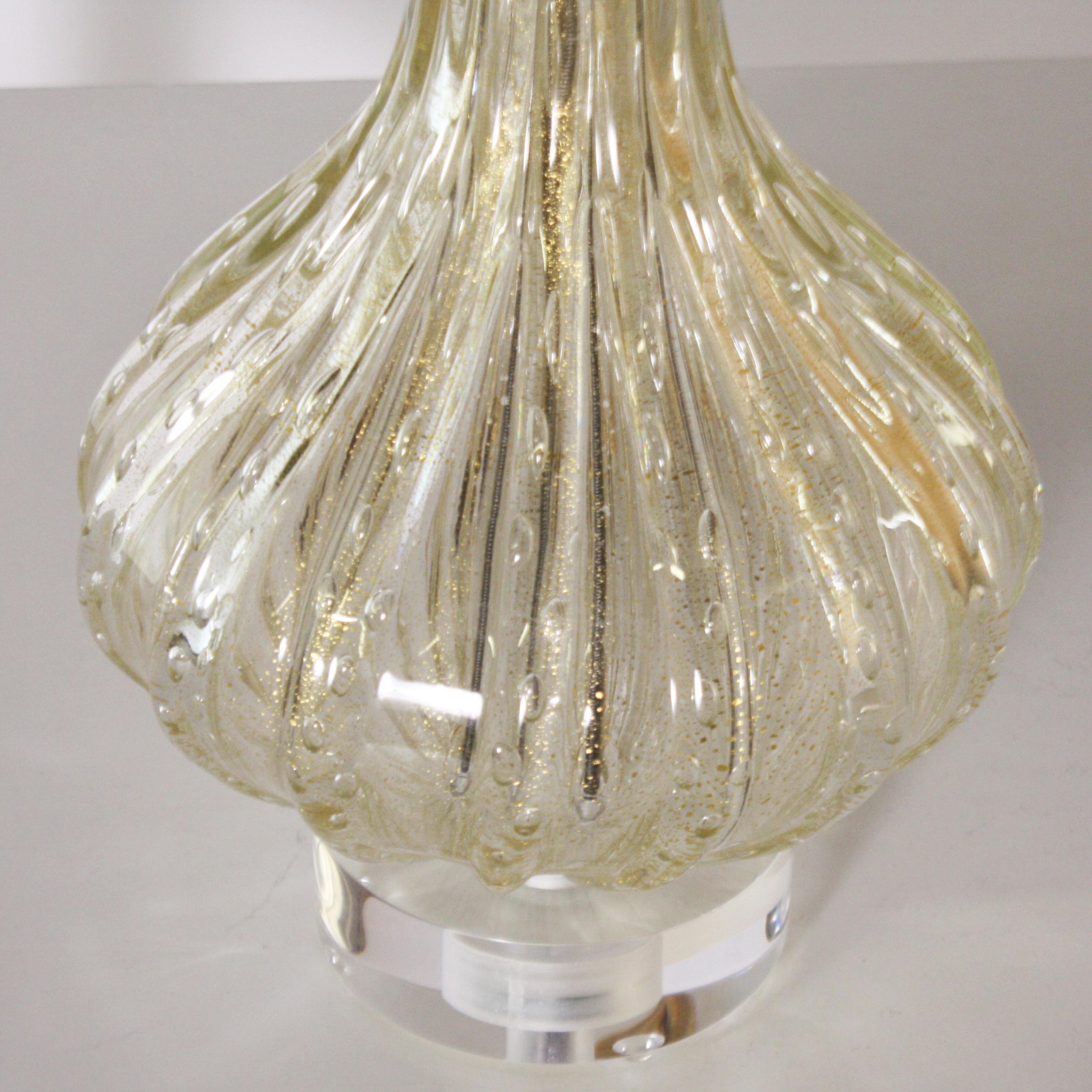 Gold Barovier lamp with clear inclusions, circa 1960.
Measures: 14” diameter x 28” height.