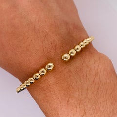 Bracelet manchette souple en or jaune 14 carats et perles BG4585