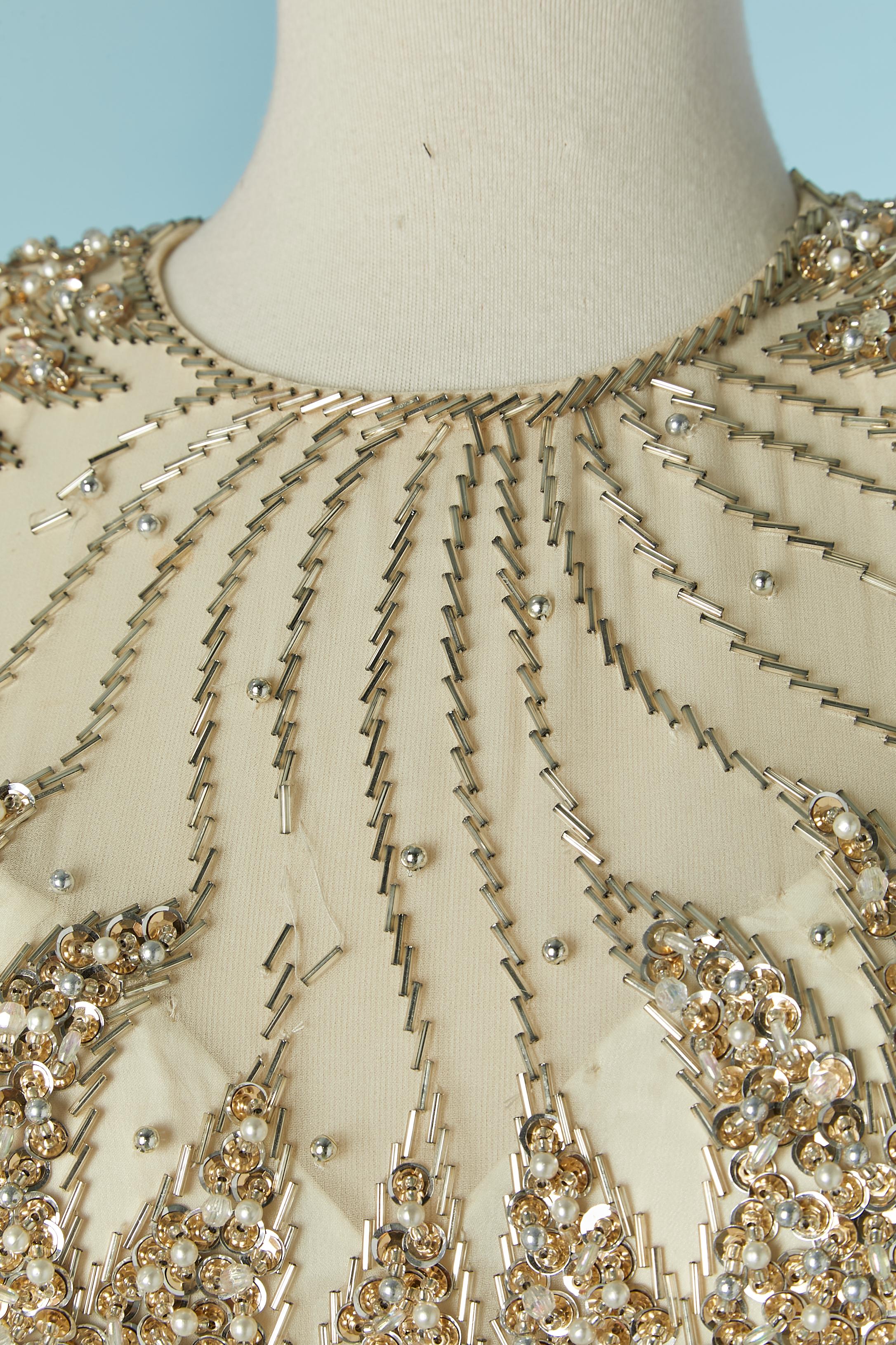 Gold beaded cocktail dress with bead fringes . Main fabric composition: 100% silk. Lining: 100% rayon. Padded bra.
Invisible zip closure on the middle back + hook&eye.
Size on tag 6 (US) M 