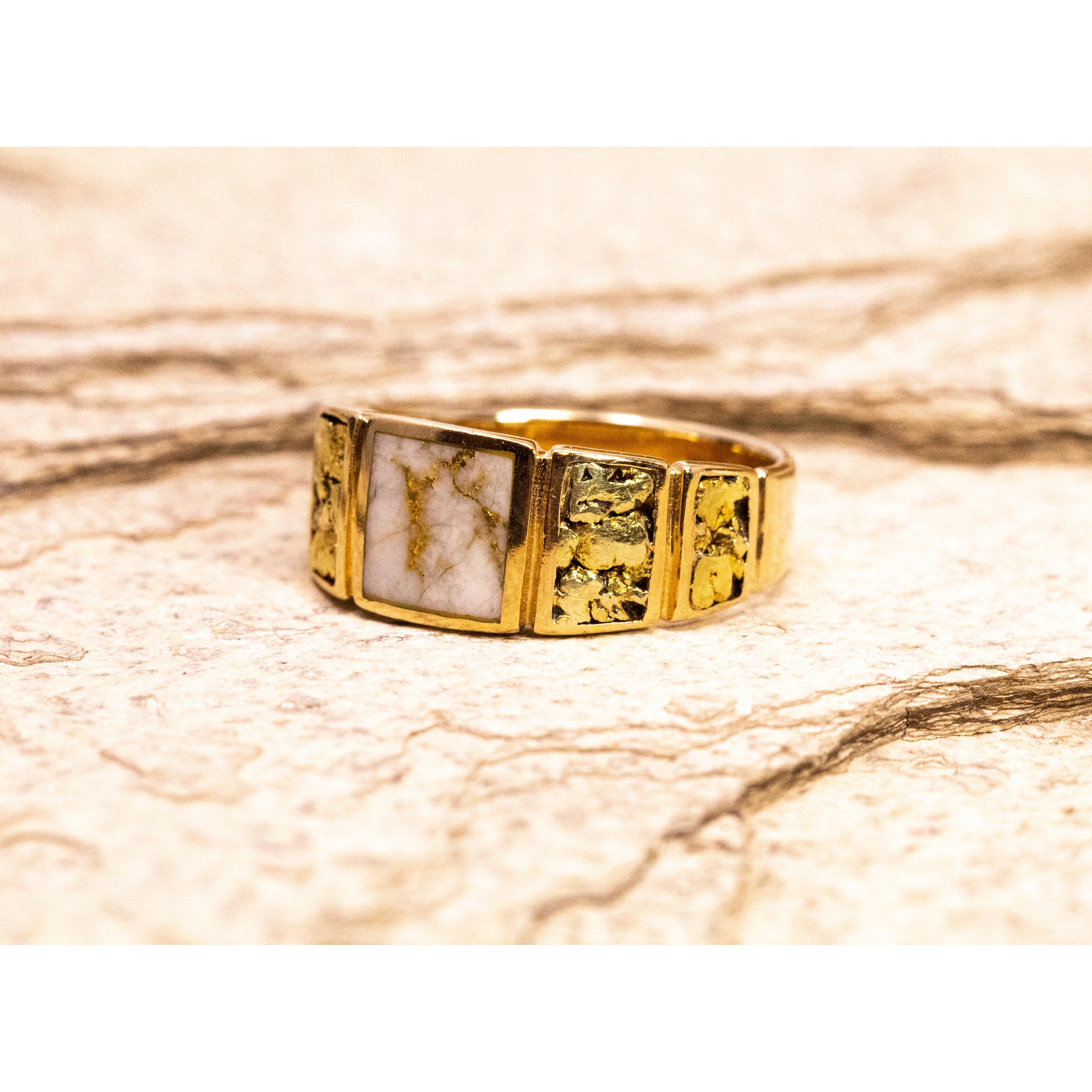This beautifully sculpted band features natural gold bearing quartz and gold nuggets in a ring that balances modern sensibilities with classic style and material. This substantially made solid ring will continue to wear well, and will be a timeless