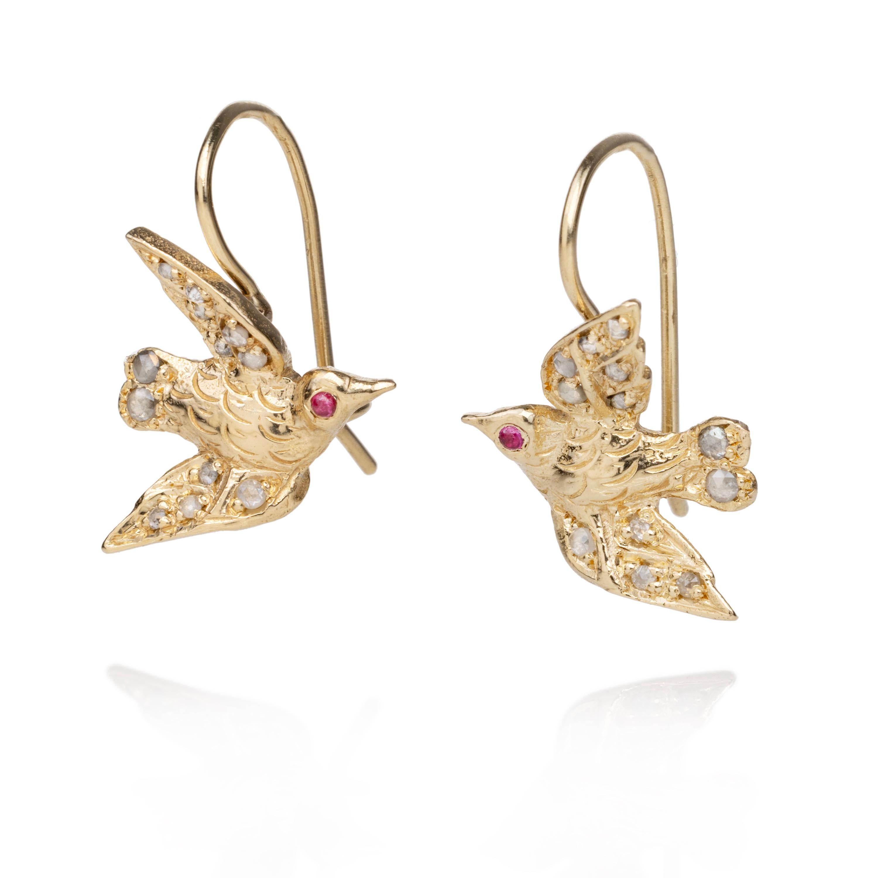 These exquisite, 14k yellow gold 'Poesie Bird' earrings are handmade, using the ancient 'lost wax casting' technique, originating from a Blackbird and the Snow original carving. Each bird features 12 salt and pepper 'rose cut' diamonds and a single
