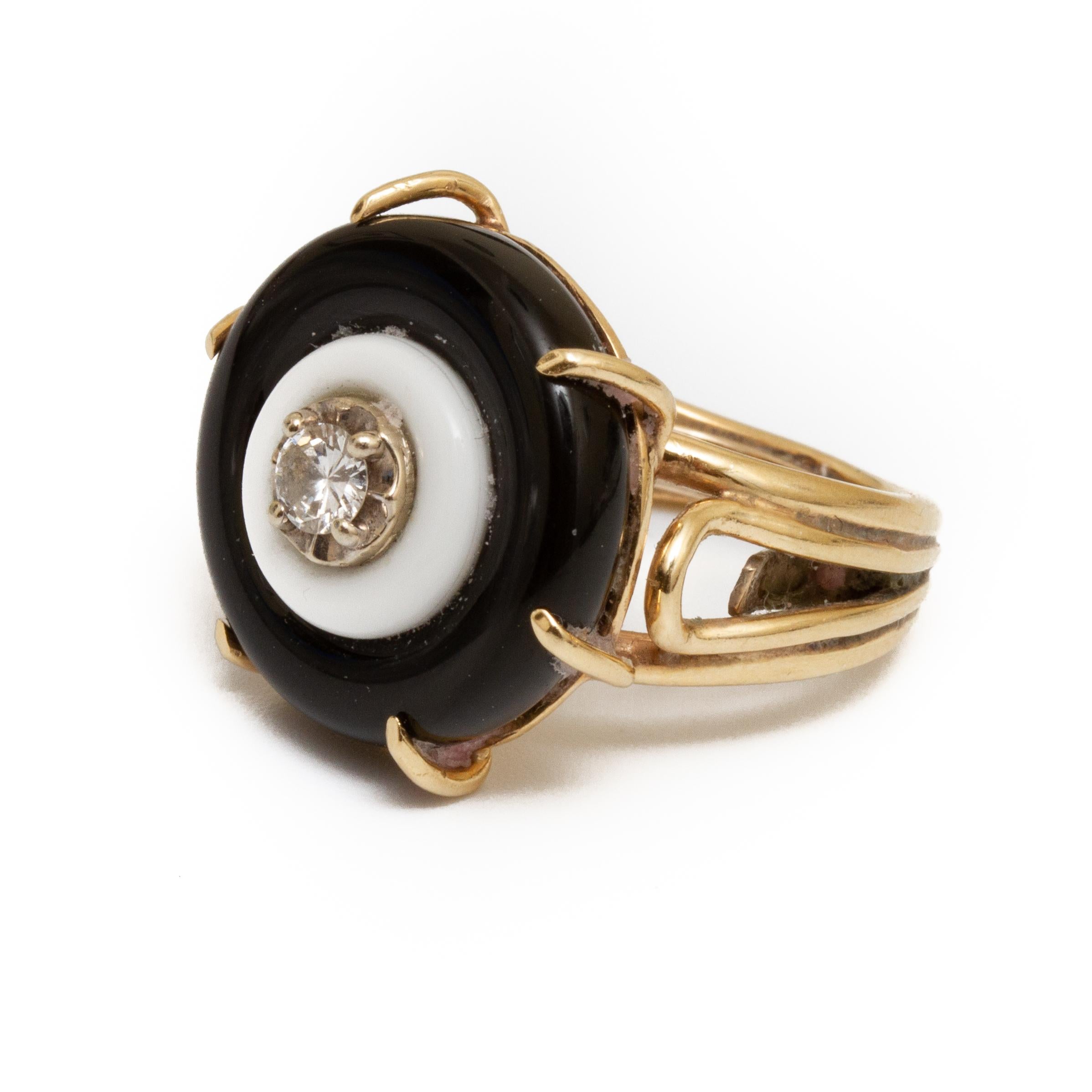 14k gold black and white onyx with one round diamond of approx. .12 ct approx. size 6 without guard and weighing approx. 5 DWT From the Broussard estate noted jewelry collection Park Avenue New York