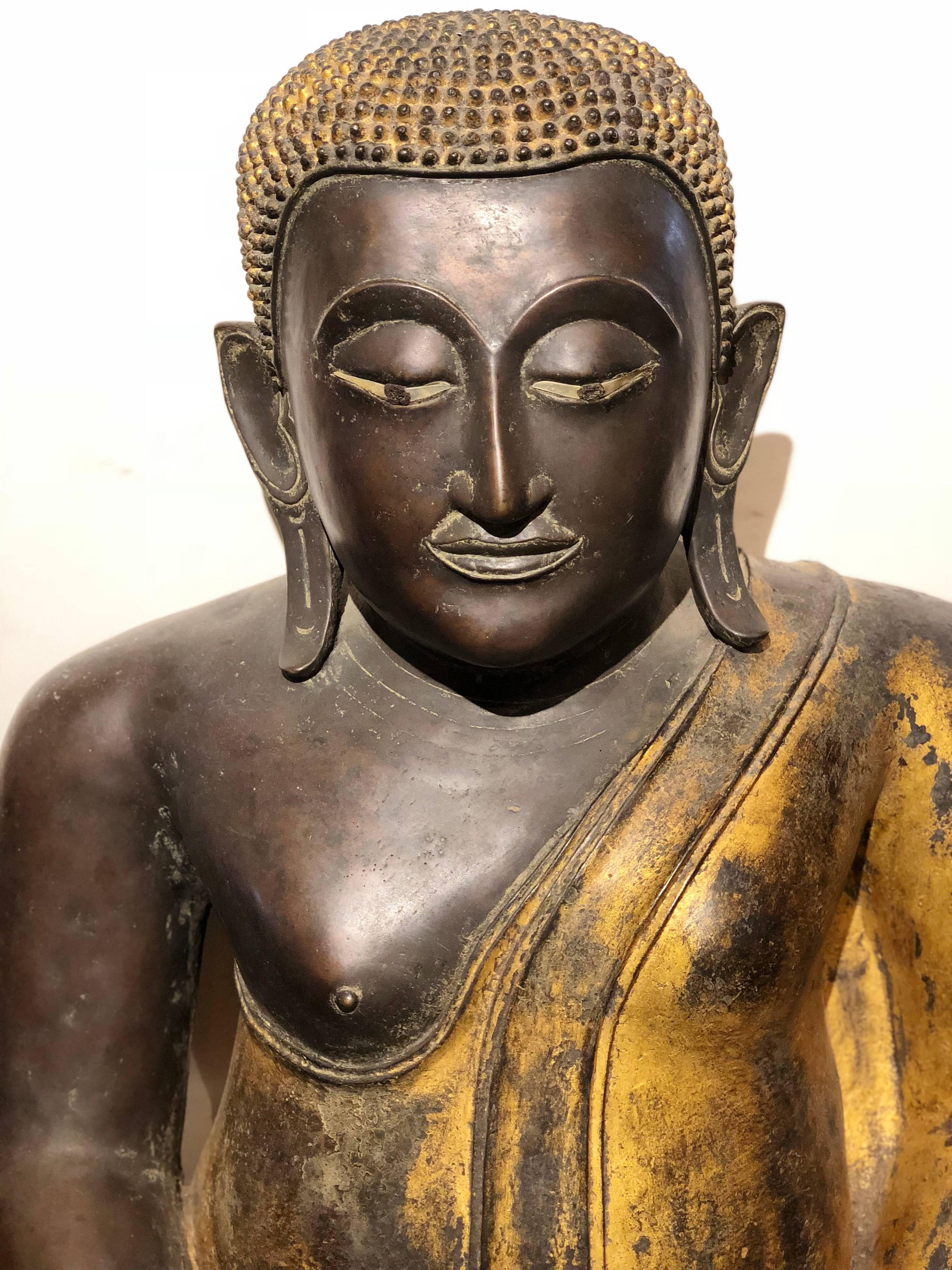 This majestic seated Buddha is from Rattanakosin Island, a historic area in the Phra Nakhon district in the city of Bangkok, Thailand. It is from the 19th century. It has bold black and gold colors and is made out of bronze.
Measures: 32 H x 32 L x